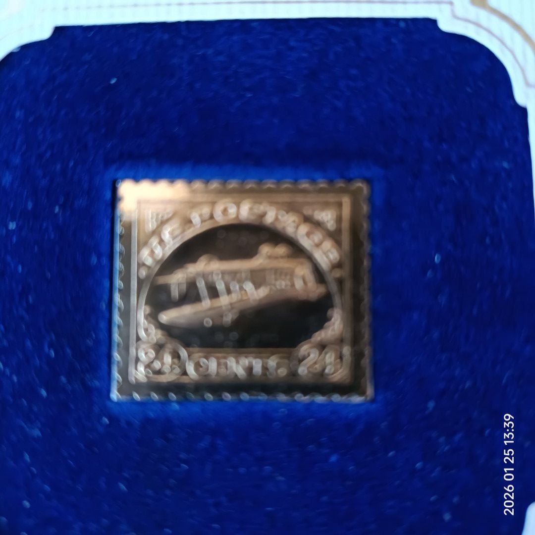24 Cent Inverted Jenny Gold Replica Stamp (Category: Stamps & Prints) located in Calasiao. Submitted by anthonypeter (Listing ID 1417664895, Image 1). Description: 24 Cent Inverted Jenny 22kt Gold Replica stamp. It is an Air Mail Issue from 1918. The stamp is presented in a blue velvet-lined display case. The item also includes an enlarged reproduction of the original stamp. The First Day of Issue was May 13, 1918..