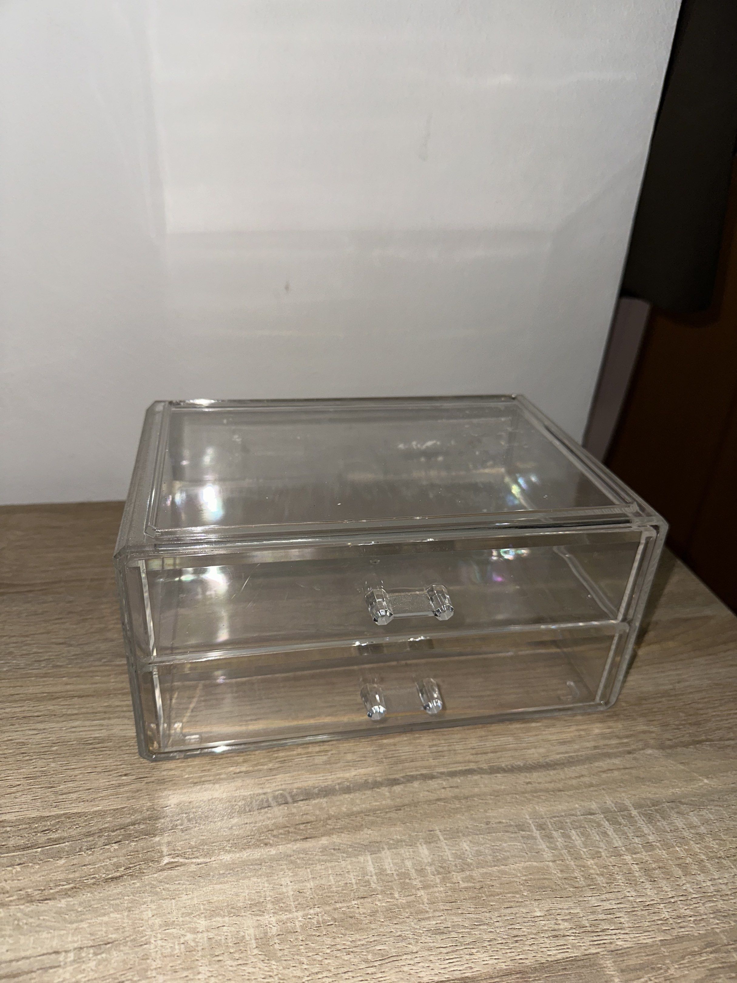 Acrylic Makeup Organizer with Drawers (Category: Makeup) located in Quezon City. Submitted by ina517 (Listing ID 1417748336, Image 2). Description: Clear acrylic makeup organizer with two drawers and a top compartment. The organizer is rectangular and has a clear, transparent design. It is suitable for storing makeup, skincare, or other small items. Dimensions are approximately 20cm in length, 10cm in height, and 15cm in width. The organizer has 
