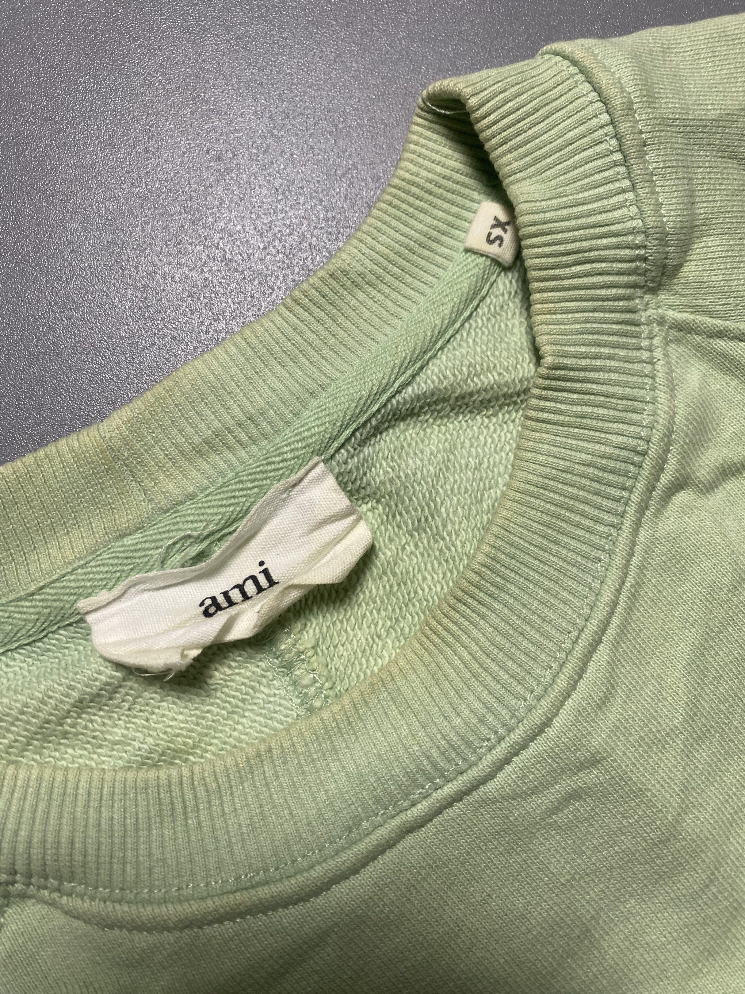 AMI Paris Green Sweatshirt XS (Category: Longsleeves) located in Manila. Submitted by anthony1723 (Listing ID 1417765695, Image 3). Description: - AMI Paris sweatshirt - Size: XS - Features the AMI logo - Crew neck - Long sleeves - Soft material - Relaxed fit.