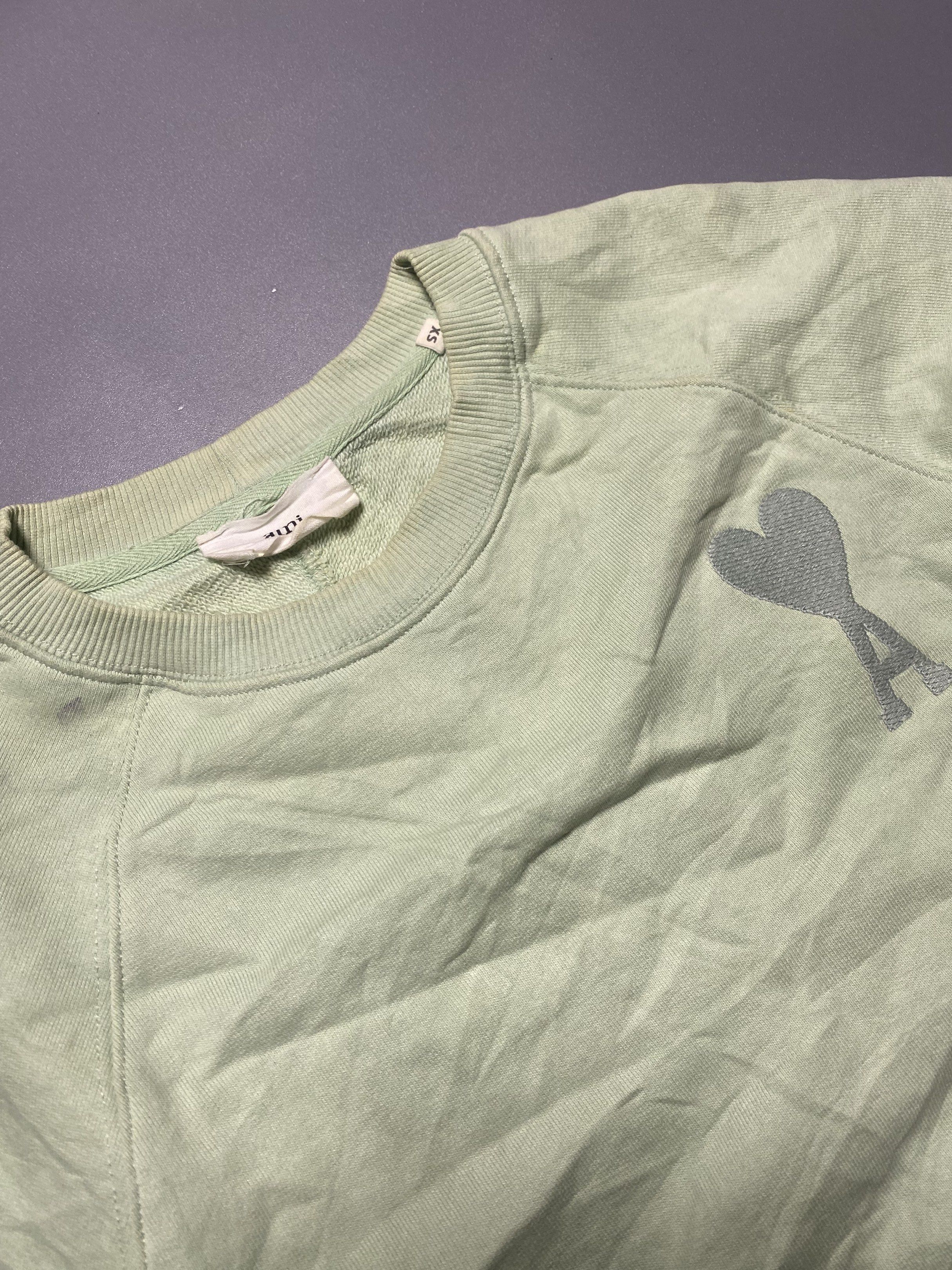 AMI Paris Green Sweatshirt XS (Category: Longsleeves) located in Manila. Submitted by anthony1723 (Listing ID 1417765695, Image 2). Description: - AMI Paris sweatshirt - Size: XS - Features the AMI logo - Crew neck - Long sleeves - Soft material - Relaxed fit.