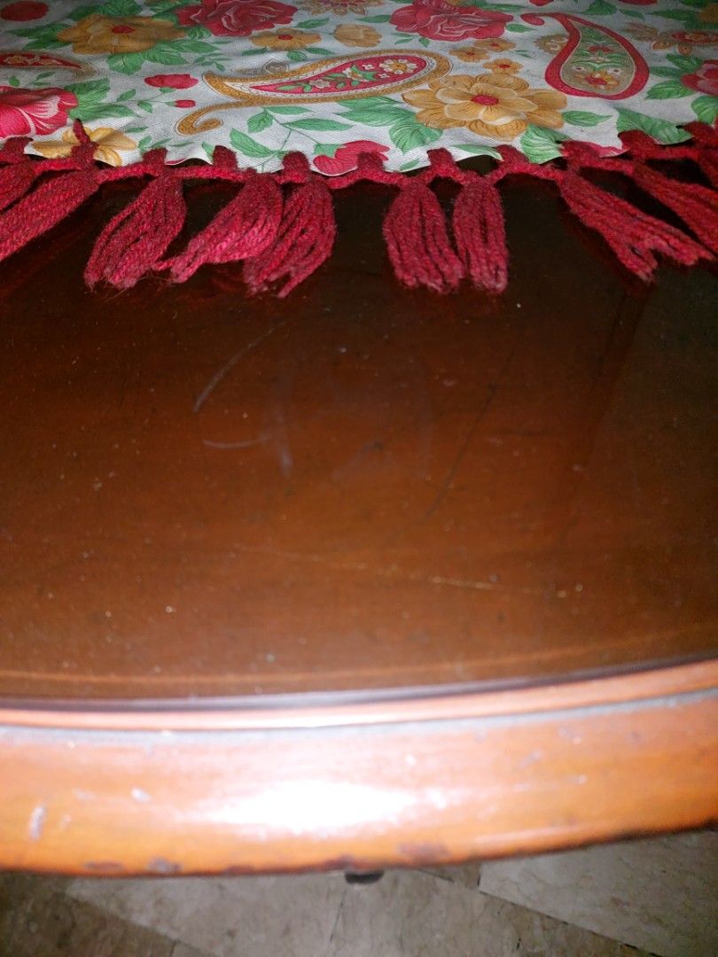 Antique Round Wooden Coffee Table with Drawer (Category: Tables & Sets) located in Makati City. Submitted by noel12 (Listing ID 1417637460, Image 2). Description: - Antique Round coffee table - Dark wooden finish - Features a drawer for storage - Unique carved pedestal base - Includes a round glass top - Ideal for living rooms and lounges - Classic and sophisticated design - Size: 46"diameter x 31"height - pls inquire at 0917-8090821 for further 
