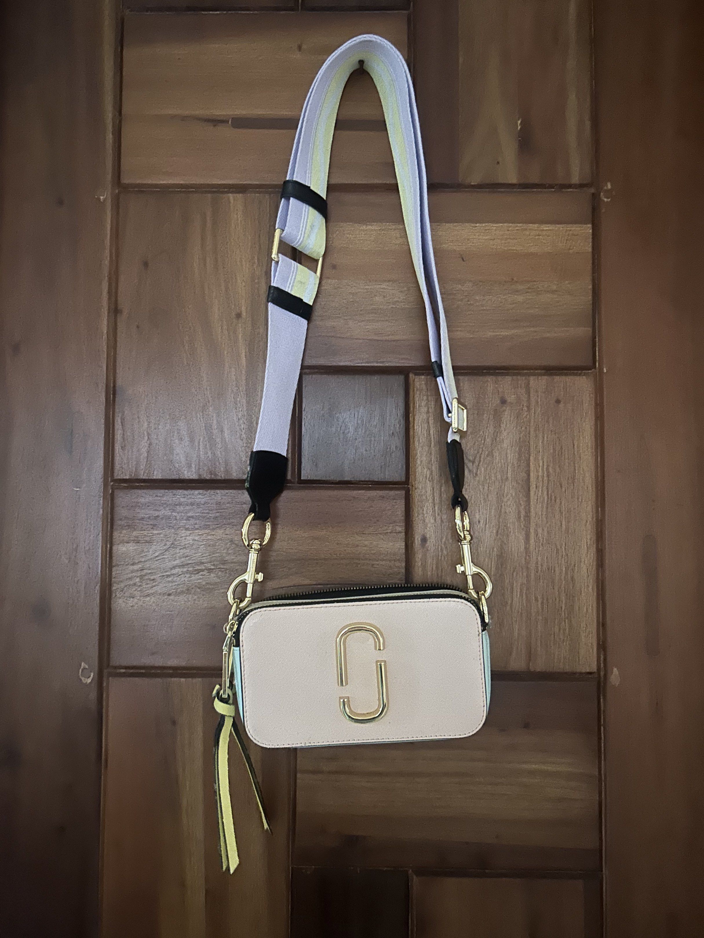 Authentic MARC JACOBS Snapshot Crossbody Bag (Category: Luxury Bags & Wallets) located in Las Pinas. Submitted by jc_closet (Listing ID 1417694343, Image 1). Description: 💯 Authentic bought from Takashimaya SG Bag & Strap Only. No inclusions. Flaw : Broken Webbing Loop (Manually Sewn) and broken 1 zipper puller (Sewn too) Pls refer to photos for minor signs of Usage. Clean interior. Shiny gold Hardware. Best Buy for everyday use. Shipping c/o Bu