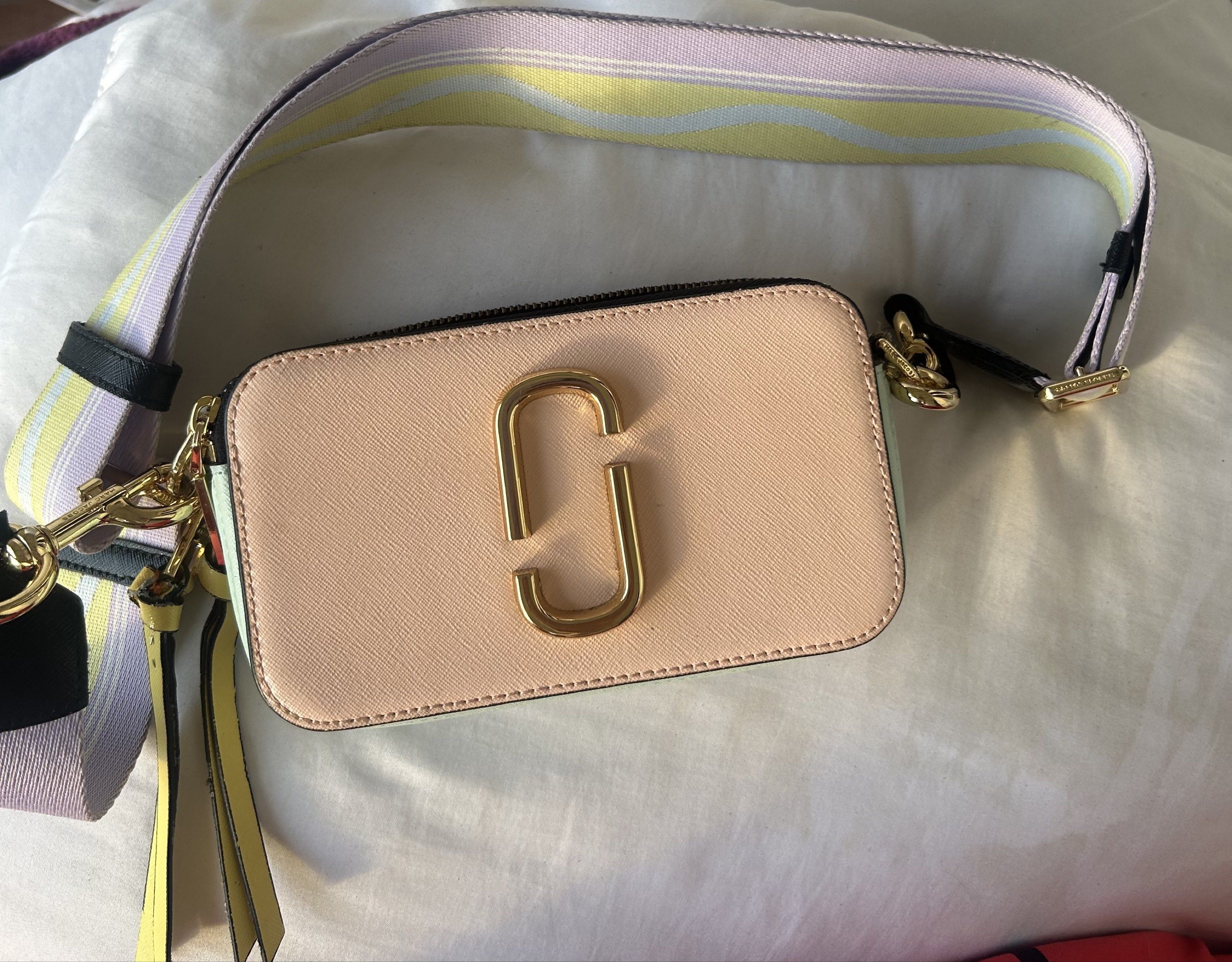 Authentic MARC JACOBS Snapshot Crossbody Bag (Category: Luxury Bags & Wallets) located in Las Pinas. Submitted by jc_closet (Listing ID 1417694343, Image 2). Description: 💯 Authentic bought from Takashimaya SG Bag & Strap Only. No inclusions. Flaw : Broken Webbing Loop (Manually Sewn) and broken 1 zipper puller (Sewn too) Pls refer to photos for minor signs of Usage. Clean interior. Shiny gold Hardware. Best Buy for everyday use. Shipping c/o Bu