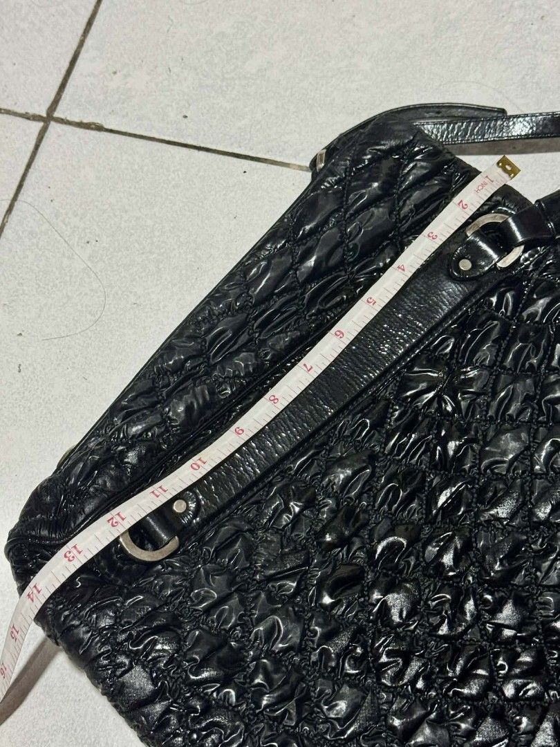 Bally Black Quilted Shoulder Bag (Category: Luxury Bags & Wallets) located in Pasig City. Submitted by Monica.RB (Listing ID 1417647181, Image 3). Description: - Bally black quilted shoulder bag - Glossy finish - Shoulder strap - Zipper closure - Bally logo plate inside - Textured design - Leather tag with brand name - Silver hardware -Limited edition -Only concern -- there's a part that is sticky but not affect the total condition and beauty of 