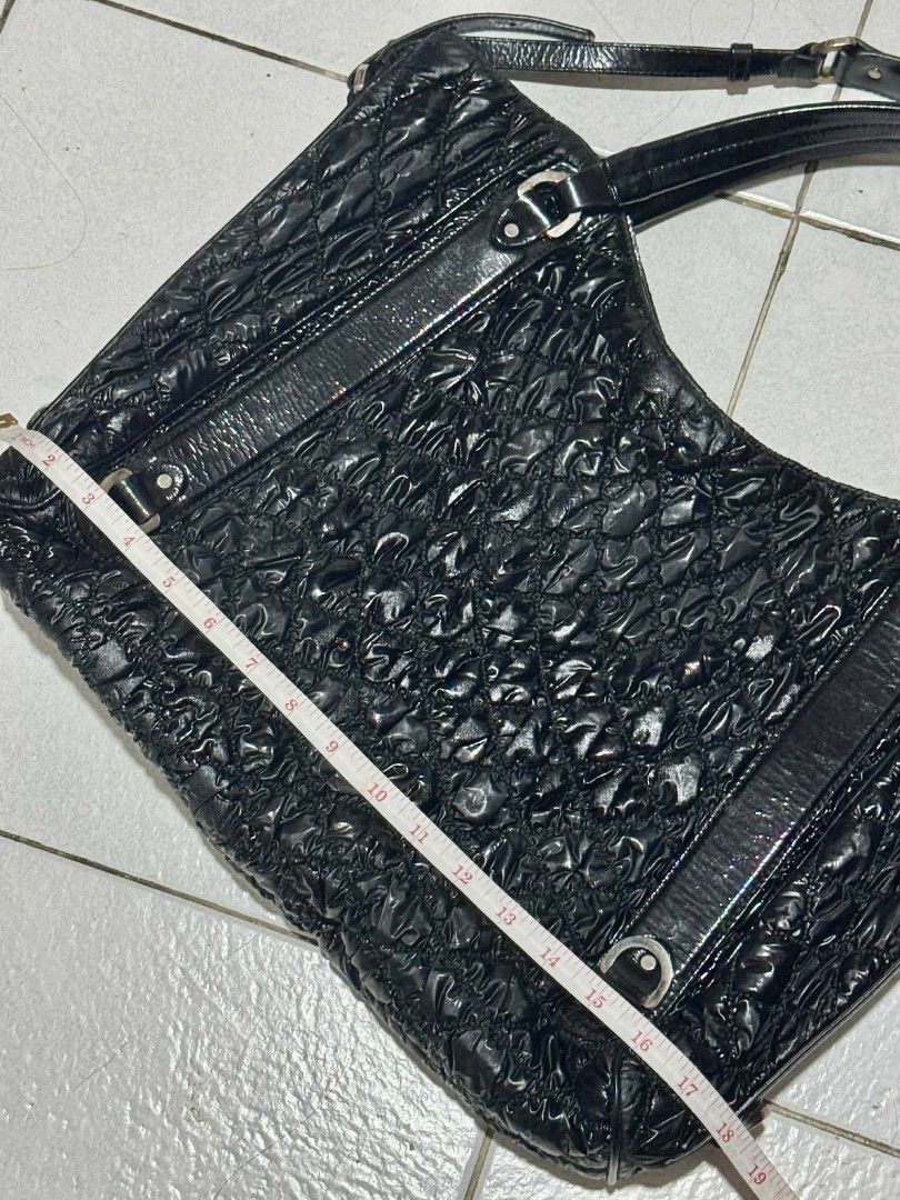 Bally Black Quilted Shoulder Bag (Category: Luxury Bags & Wallets) located in Pasig City. Submitted by Monica.RB (Listing ID 1417647181, Image 1). Description: - Bally black quilted shoulder bag - Glossy finish - Shoulder strap - Zipper closure - Bally logo plate inside - Textured design - Leather tag with brand name - Silver hardware -Limited edition -Only concern -- there's a part that is sticky but not affect the total condition and beauty of 