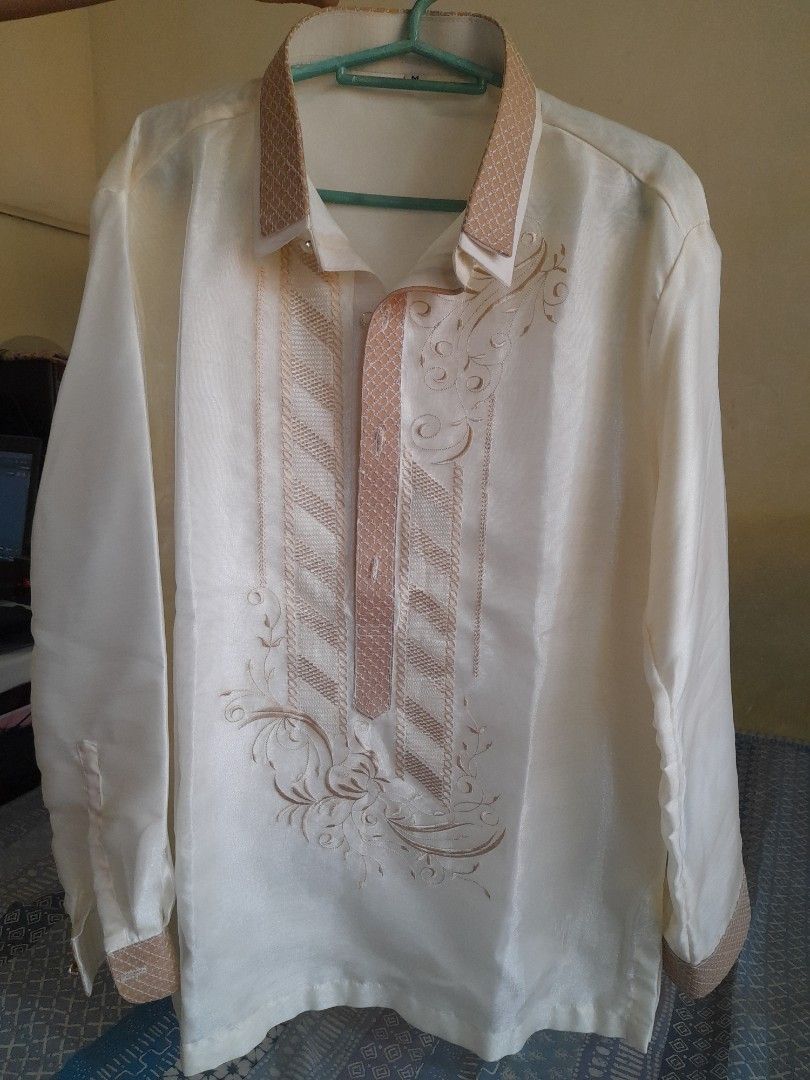 Barong Long Sleeve (Category: Coats, Jackets and Outerwear) located in San Pedro. Submitted by JohnsonKeeps (Listing ID 1417664809, Image 1). Description: - Cream-colored Barong - Intricate beige embroidery - Mandarin collar and buttoned cuffs - Size: M - Ideal for formal events and special occasions .