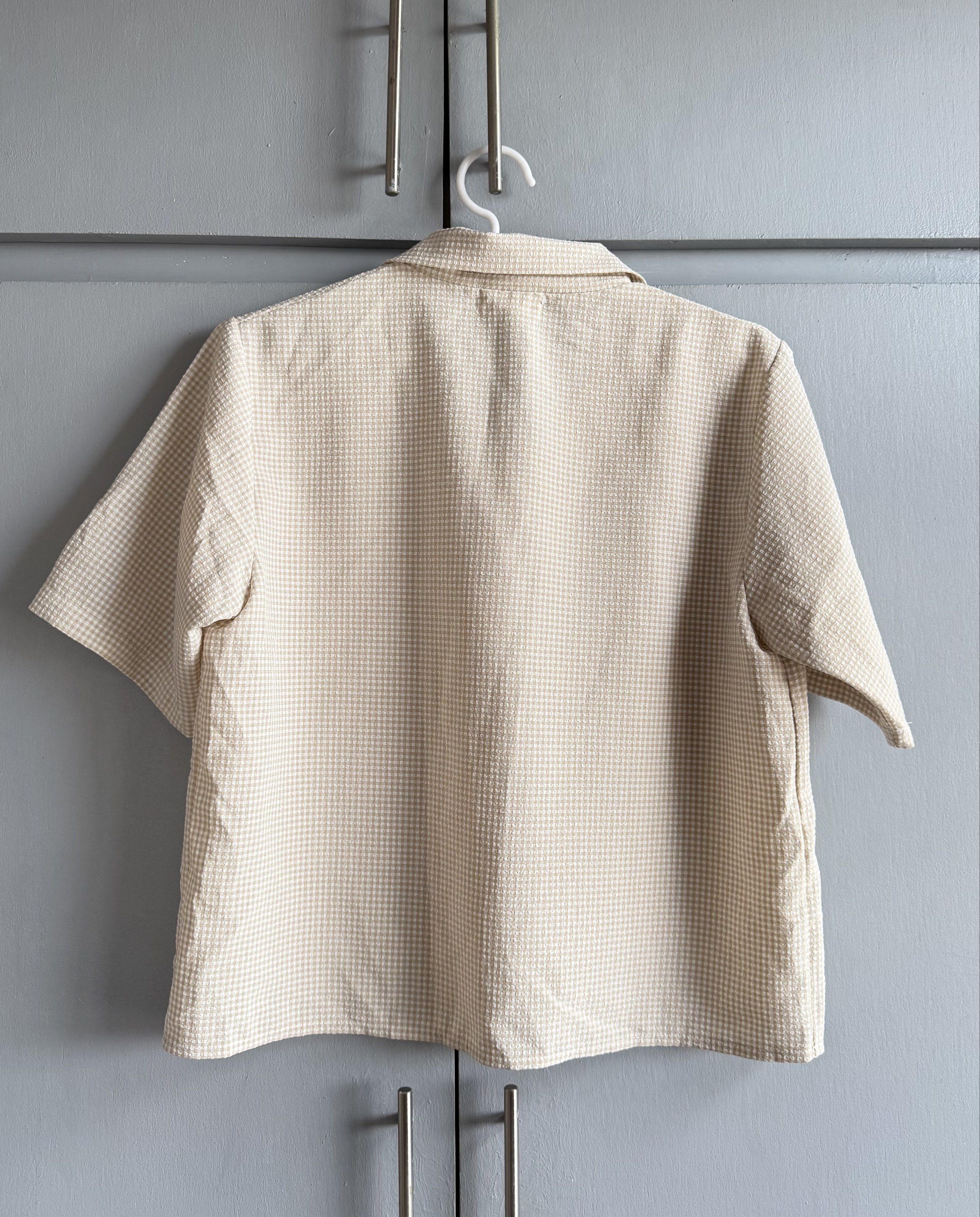 Beige Gingham Boxy Polo Shirt/Top (Category: Others Tops) located in San Juan City. Submitted by itemsfromkam (Listing ID 1417749156, Image 2). Description: • fits up to S • textured fabric, a bit stretchable, slightly boxy fit.