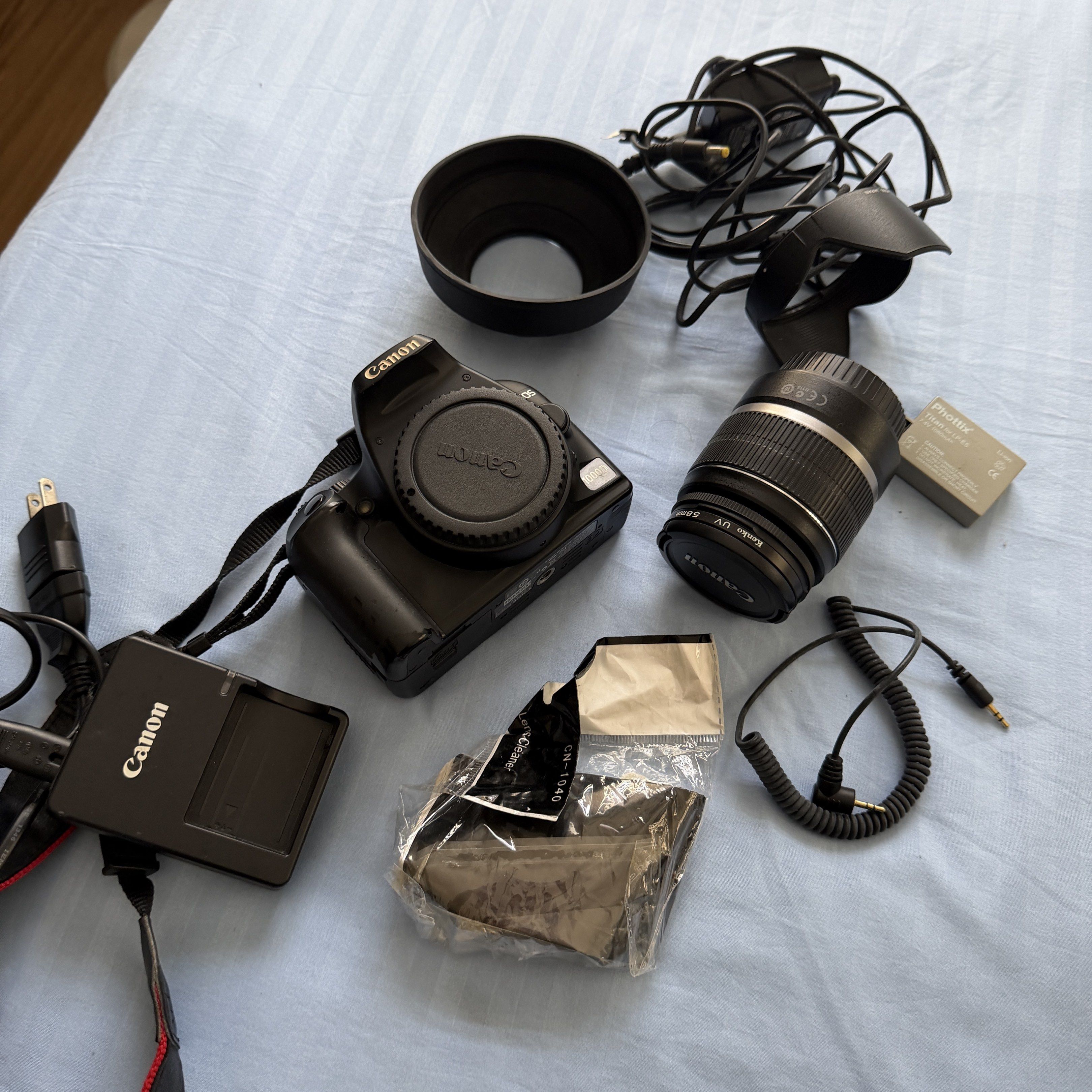 Canon EOS 1000D DSLR Camera with Accessories (Category: Cameras) located in Caloocan City. Submitted by shoppingmi28011 (Listing ID 1417637034, Image 1). Description: Used item. Haven’t used this is a while and giving a “99” error (see photo). Repricing in case someone wants to buy for repair or parts. Accessories included. RSF: Have been in the storage, not using anymore, decluttering.