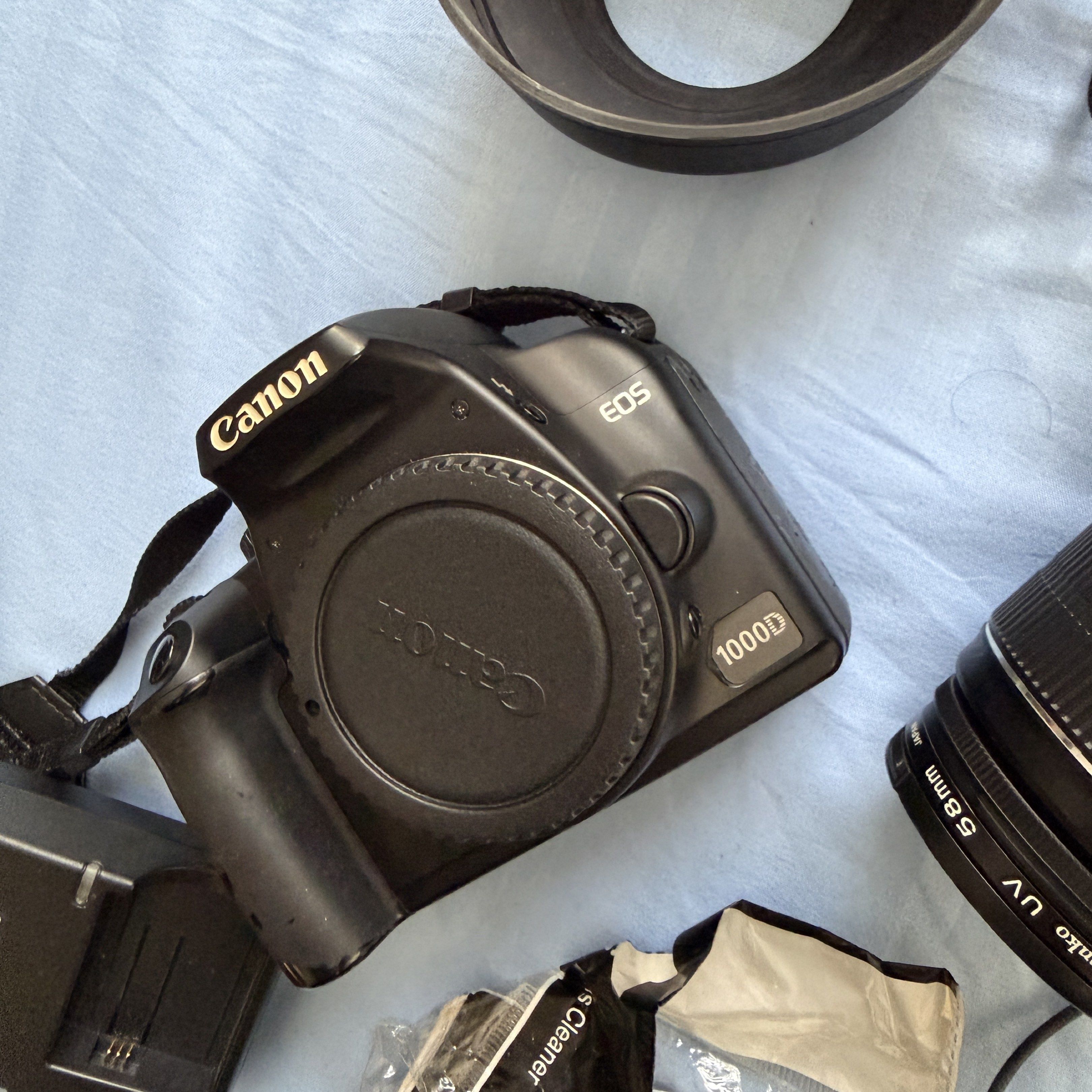 Canon EOS 1000D DSLR Camera with Accessories (Category: Cameras) located in Caloocan City. Submitted by shoppingmi28011 (Listing ID 1417637034, Image 2). Description: Used item. Haven’t used this is a while and giving a “99” error (see photo). Repricing in case someone wants to buy for repair or parts. Accessories included. RSF: Have been in the storage, not using anymore, decluttering.