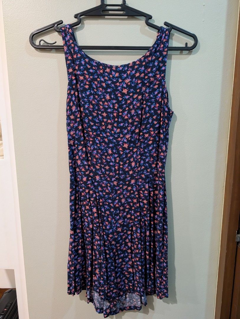 Cotton On Floral Romper XXS (Category: Rompers) located in Manila. Submitted by csisters3 (Listing ID 1417739388, Image 1). Description: - Cotton On romper - Size: XXS - Floral print (blue & pink) on navy - Sleeveless - Scoop neckline - Pleated skirt - Keyhole back detail - Made in China.