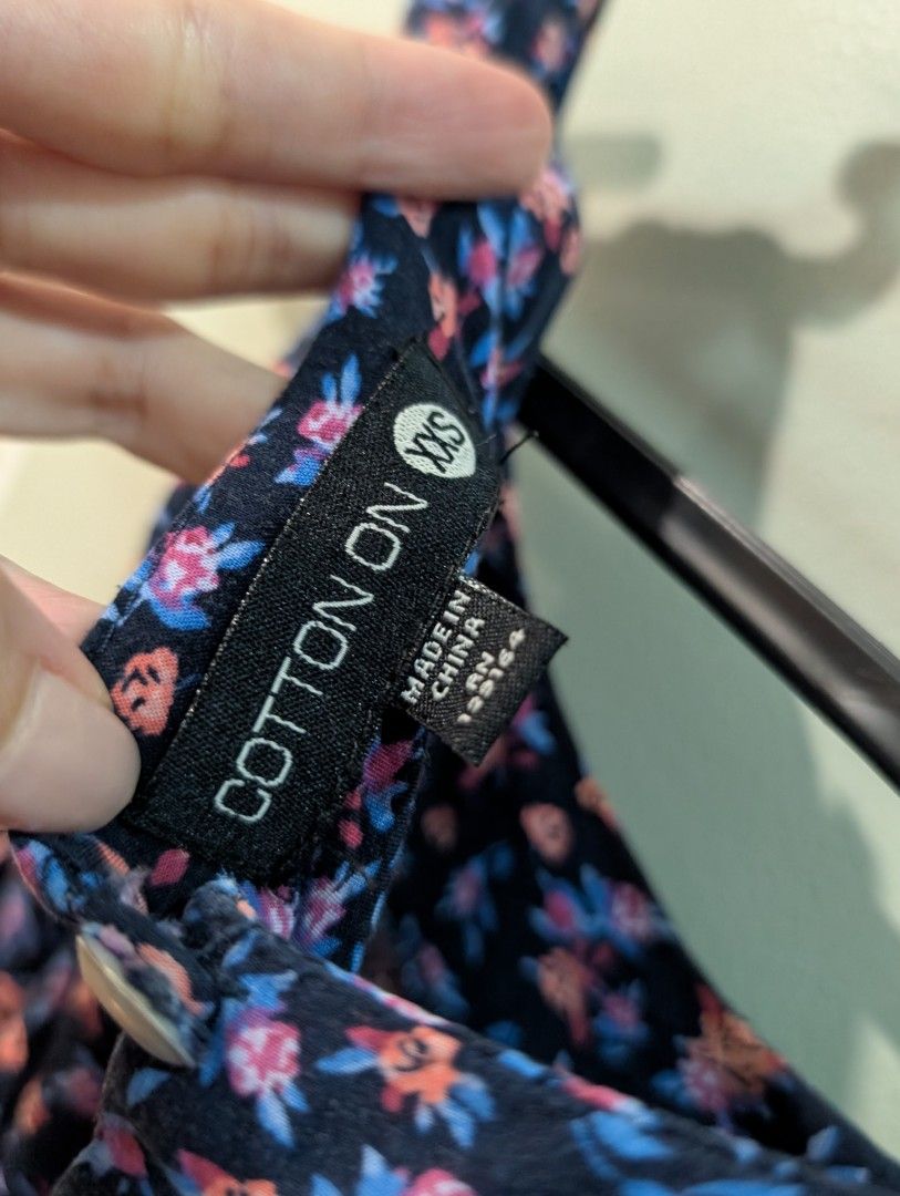 Cotton On Floral Romper XXS (Category: Rompers) located in Manila. Submitted by csisters3 (Listing ID 1417739388, Image 3). Description: - Cotton On romper - Size: XXS - Floral print (blue & pink) on navy - Sleeveless - Scoop neckline - Pleated skirt - Keyhole back detail - Made in China.