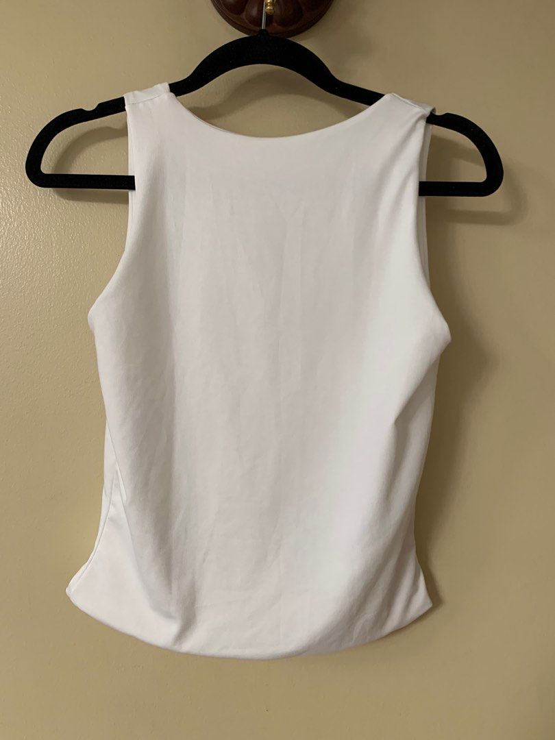 White Sleeveless Do it All Tank (2-way tank) (Category: Blouses) located in Marikina City. Submitted by projectsparkjoy (Listing ID 1417616960, Image 1). Description: Brand: Candid Clothing Color: Ecru white Size: small ✨Brand new✨ ✨Can be worn in 2 ways: Boat neckline and V-neckline tank top ✨Stretch fabric .