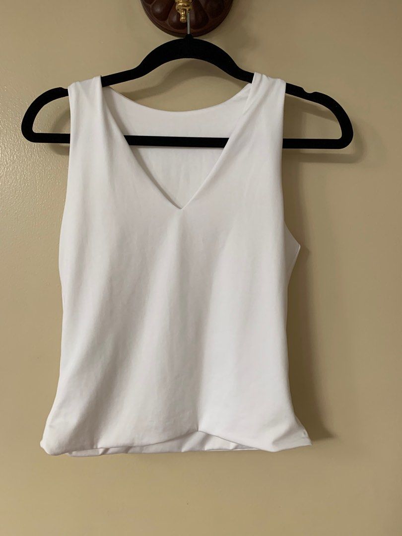 White Sleeveless Do it All Tank (2-way tank) (Category: Blouses) located in Marikina City. Submitted by projectsparkjoy (Listing ID 1417616960, Image 2). Description: Brand: Candid Clothing Color: Ecru white Size: small ✨Brand new✨ ✨Can be worn in 2 ways: Boat neckline and V-neckline tank top ✨Stretch fabric .