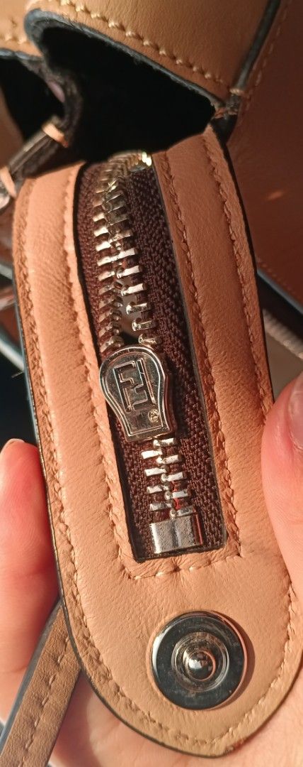 Fendi Handbag (Category: Luxury Bags & Wallets) located in Legazpi City. Submitted by georgepineda791 (Listing ID 1417622884, Image 2). Description: ❣️Preloved Fendi Dotcom Handbag 🤍 ❣️With etiketa and code inside. ❣️Features branded hardware and original underzip. ❣️Shows signs of usage, including some dirt (condition as is, sourced from ukay selection). ❣️No longer comes with strap and pouch. Priced accordingly. ❣️Handbag only 📌Disclaimer: Al