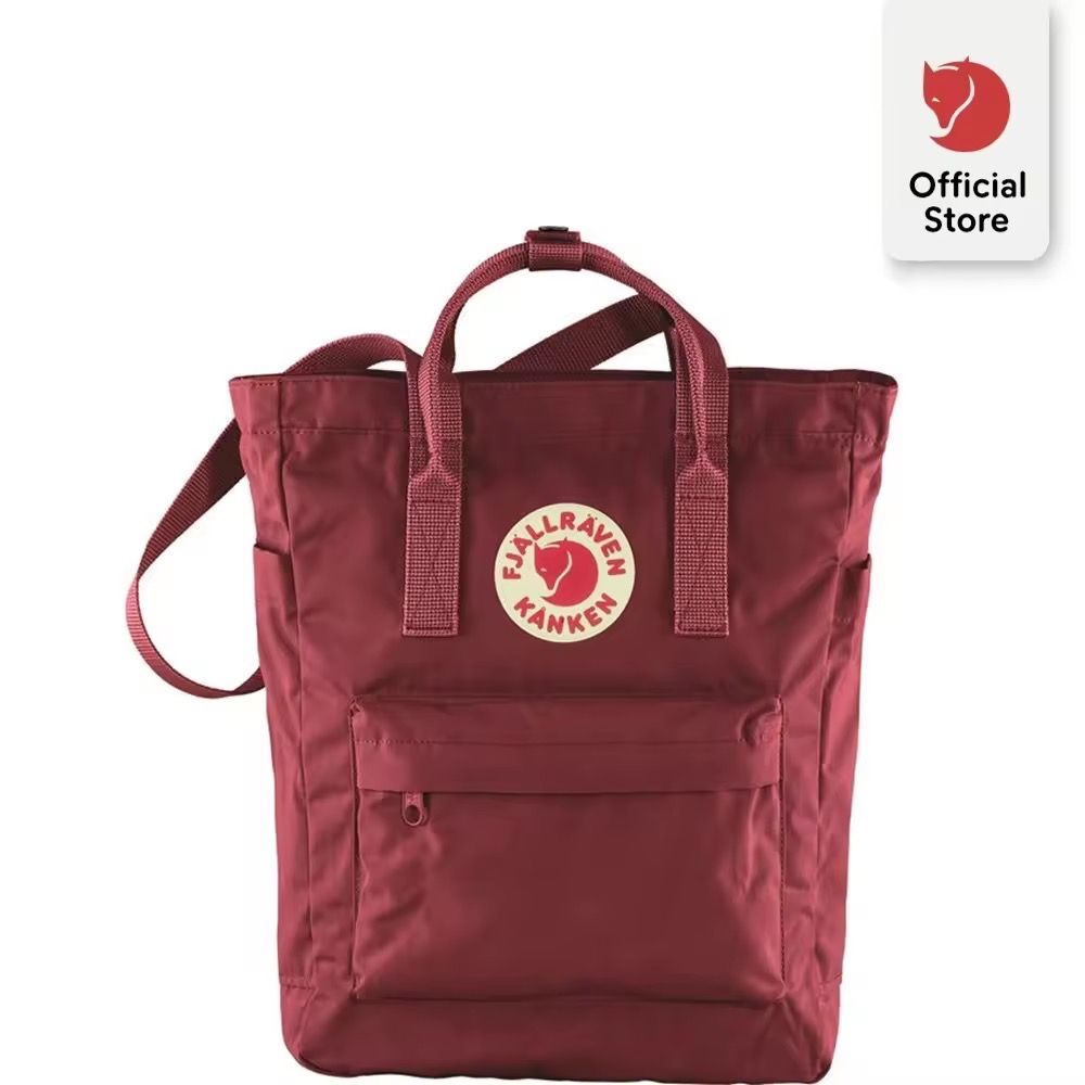 Fjallraven Kanken Totepack - Ox Red (Category: Tote Bags) located in Manila. Submitted by rencied (Listing ID 1417769972, Image 3). Description: Fjallraven Kanken Totepack in ox red. Features a main compartment with a zipper closure, front pocket, and side pockets. It has both tote handles and adjustable shoulder straps. The bag has the Fjallraven logo on the front. The back has the straps that can be used as backpack straps..