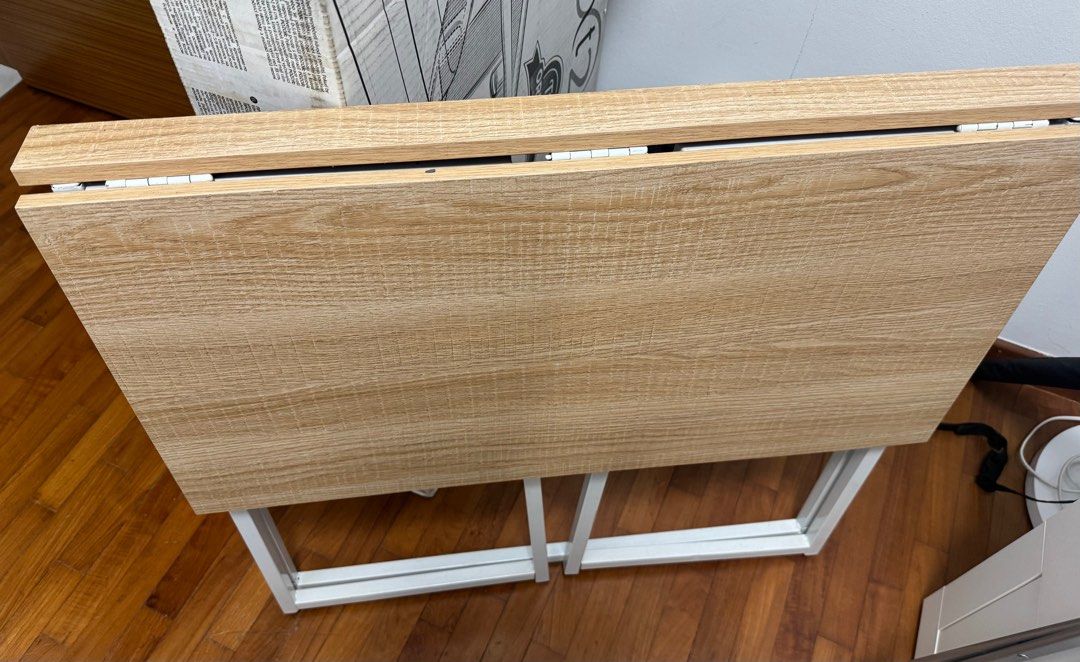 Foldable table (Category: Tables & Sets) located in Singapore. Submitted by vigneshvenkatesh (Listing ID 1417786937, Image 1). Description: - Foldable study table - Sturdy white metal frame - Open size: 79cm x 45cm.