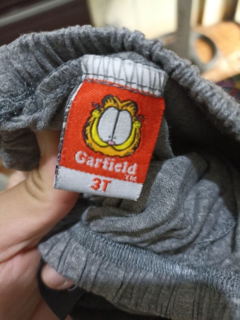 Garfield Monday Outfit - 3T (Category: Babies & Kids Fashion) located in Manila. Submitted by rslsmasi (Listing ID 1417749226, Image 3). Description: - Adorable Garfield outfit! - Includes a black Garfield t-shirt with a "Monday" graphic. - Matching gray Garfield shorts. - Shorts feature a comfortable elastic waistband. - Size: 3T - Perfect for your little one!.