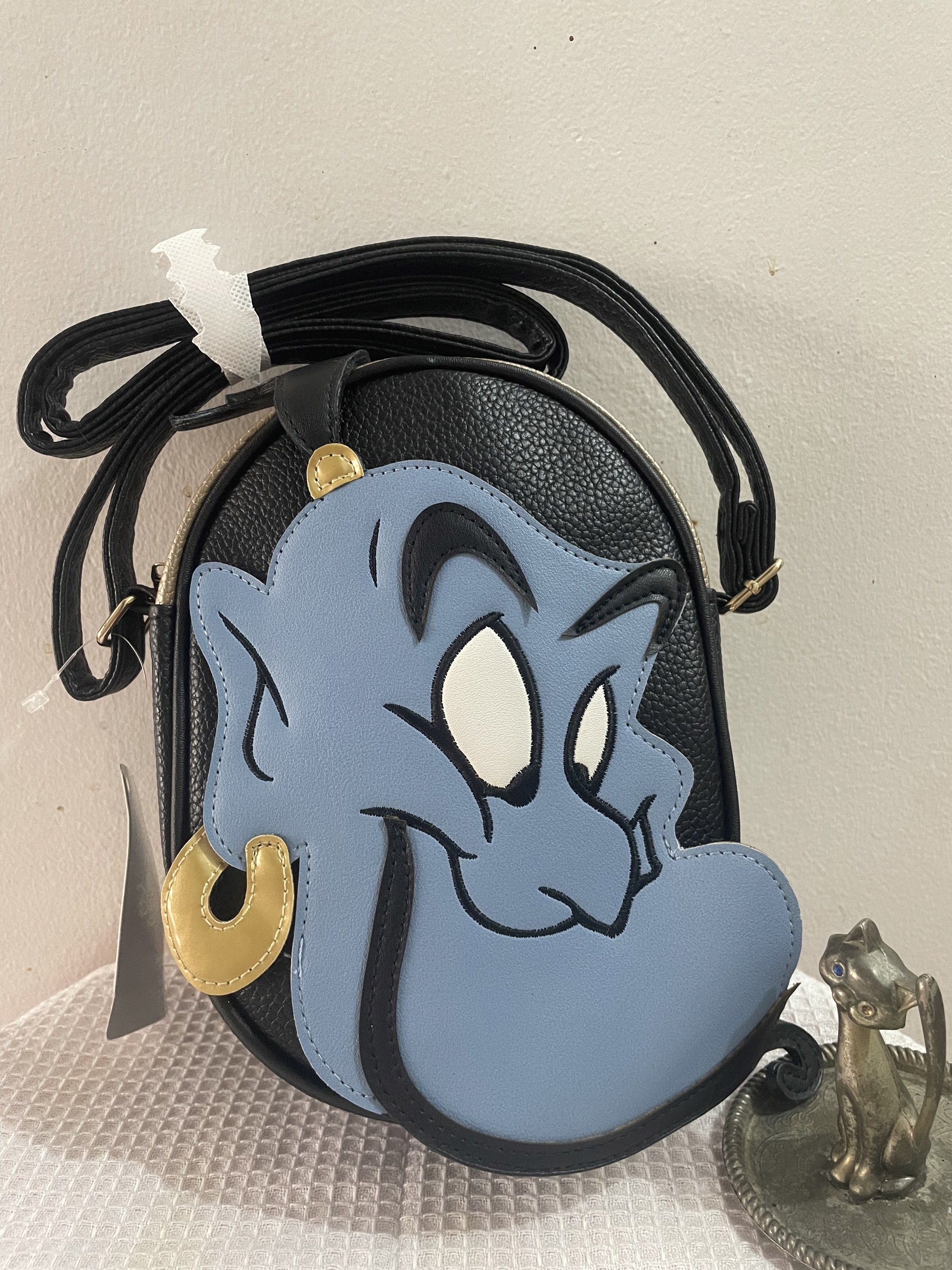 Genie Aladin Disney Sling Bag (Category: Other Babies Going Out Needs) located in Pasig City. Submitted by lilhermes (Listing ID 1417652613, Image 1). Description: Wide: 6.5 inches Height: 9 inches Fit phone .