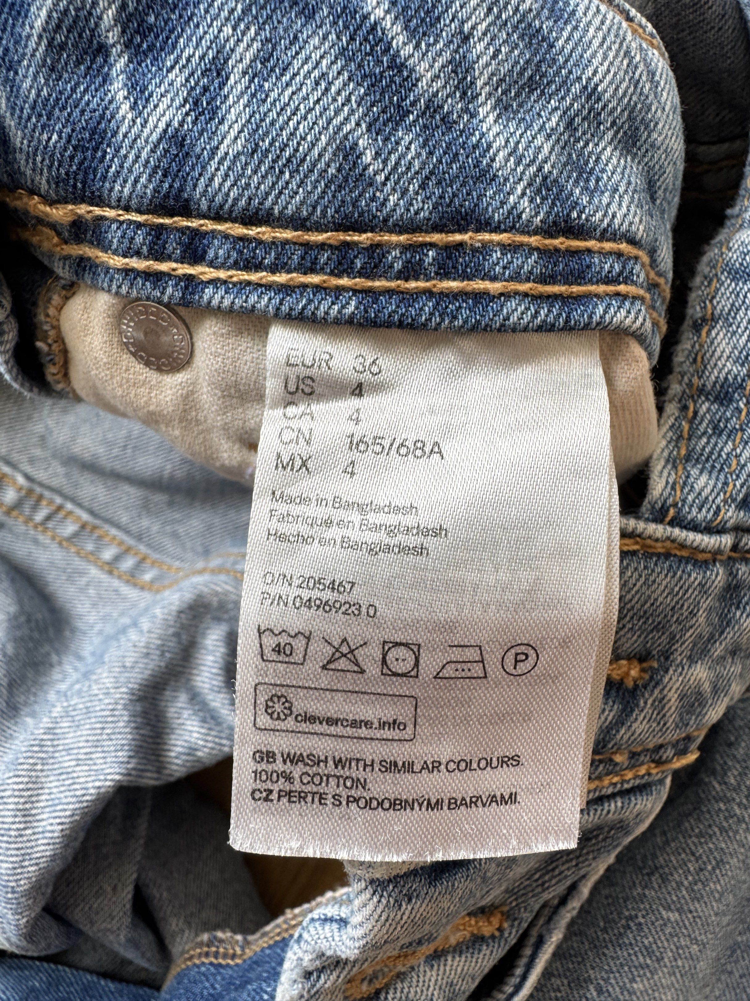 H&M Denim Overalls Shorts (Category: Jumpsuits) located in Manila. Submitted by obach (Listing ID 1417734130, Image 2). Description: - H&M denim overalls shorts - Light blue wash with distressed details - Adjustable straps - Multiple pockets - Rolled hem - Size: EUR 36, US 4, CA 4, CN 165/68A - Waist: Approximately 15 inches across - Made in Bangladesh.