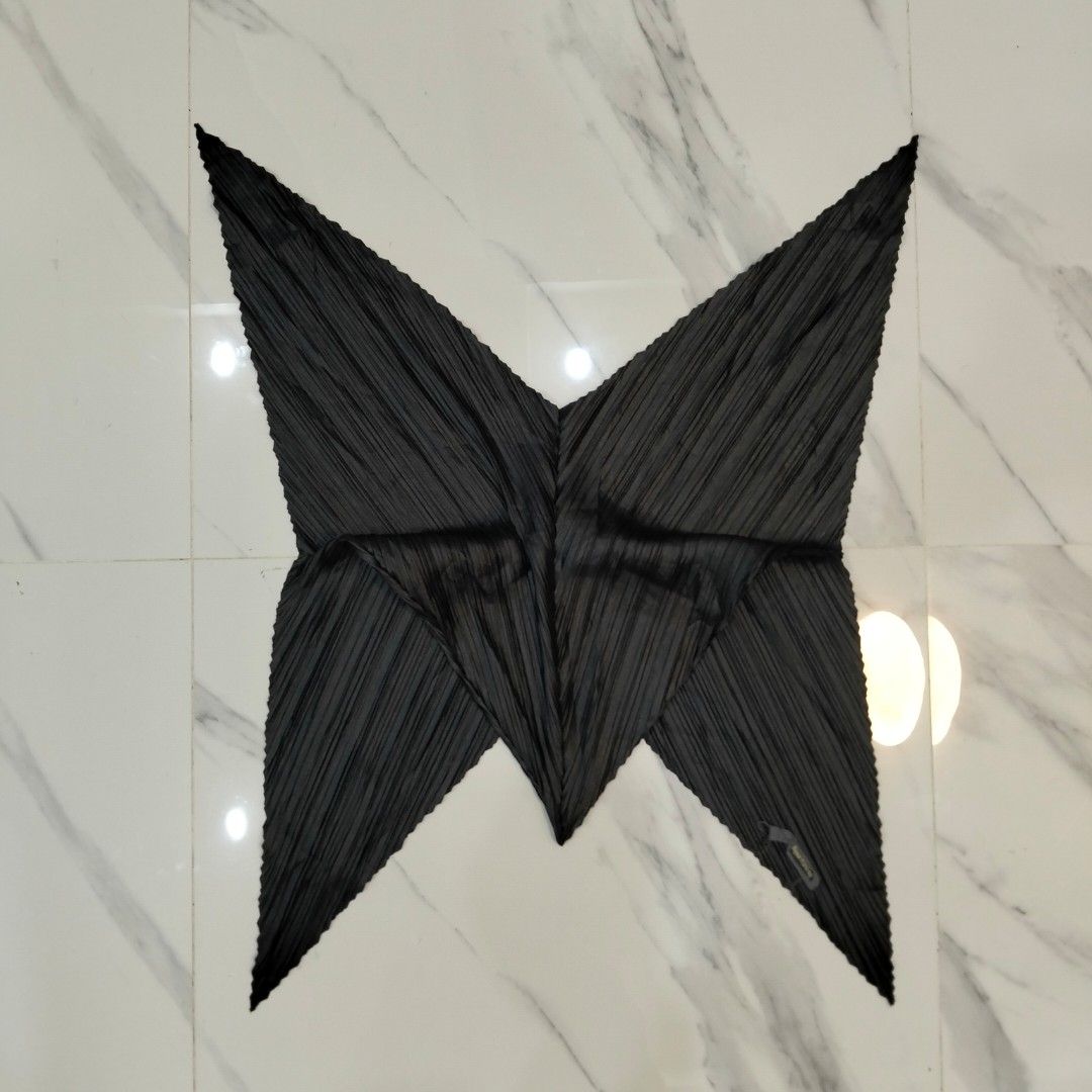 Issey Miyake Pleated Scarf (Category: Scarves) located in Dagupan City. Submitted by youngthrift_ (Listing ID 1417785444, Image 2). Description: - Issey Miyake black pleated scarf - Unique geometric design - Textured, pleated fabric - Features the Issey Miyake label - Perfect for adding sophistication.