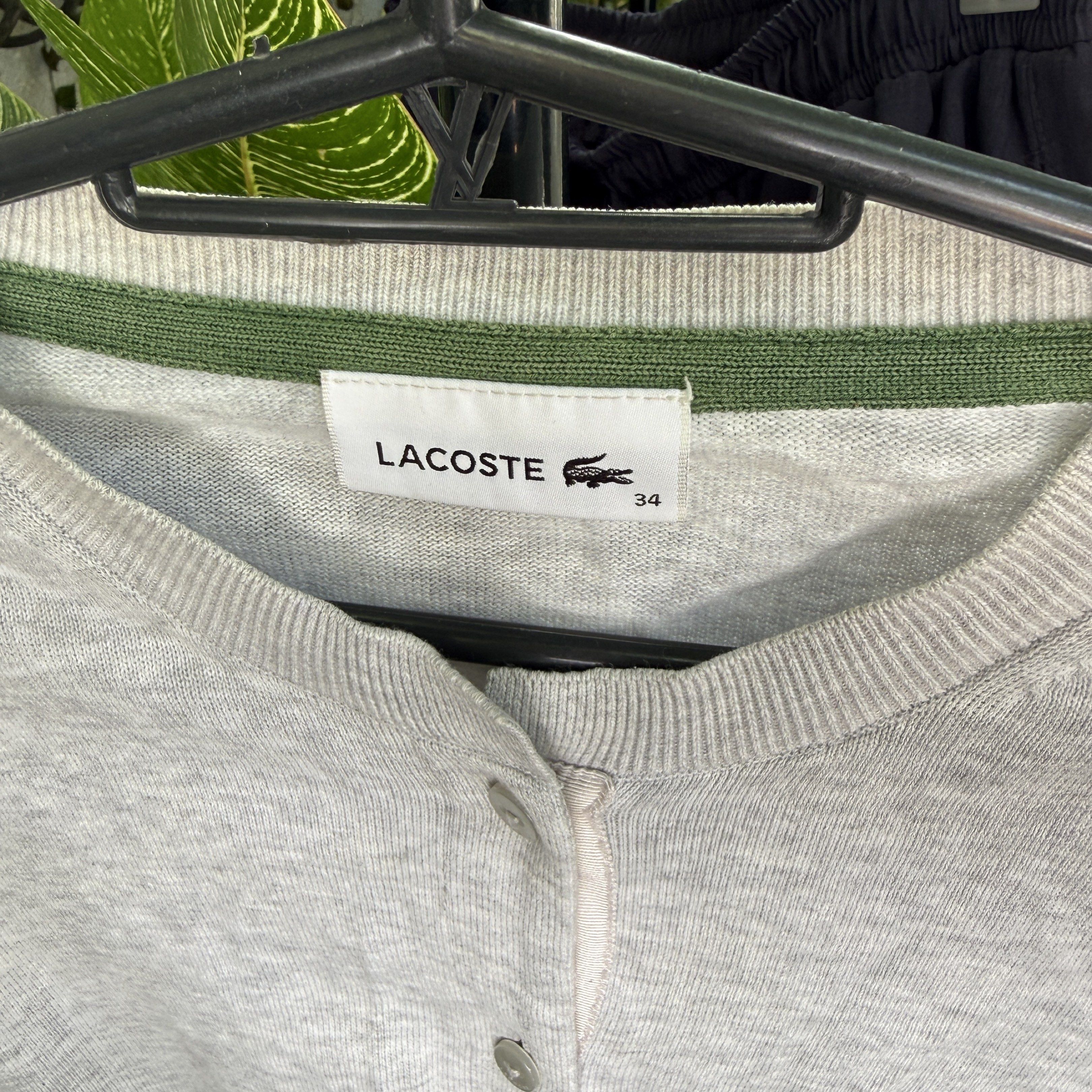 Lacoste Gray Grey Cardigan XS (Category: Coats, Jackets and Outerwear) located in Quezon City. Submitted by yth.ph (Listing ID 1417629035, Image 3). Description: - Light grey Lacoste cardigan - Crew neck - Button-down closure - Lacoste logo on chest - Size: 34 - Long sleeves - Ribbed hem and cuffs - Green collar trim.