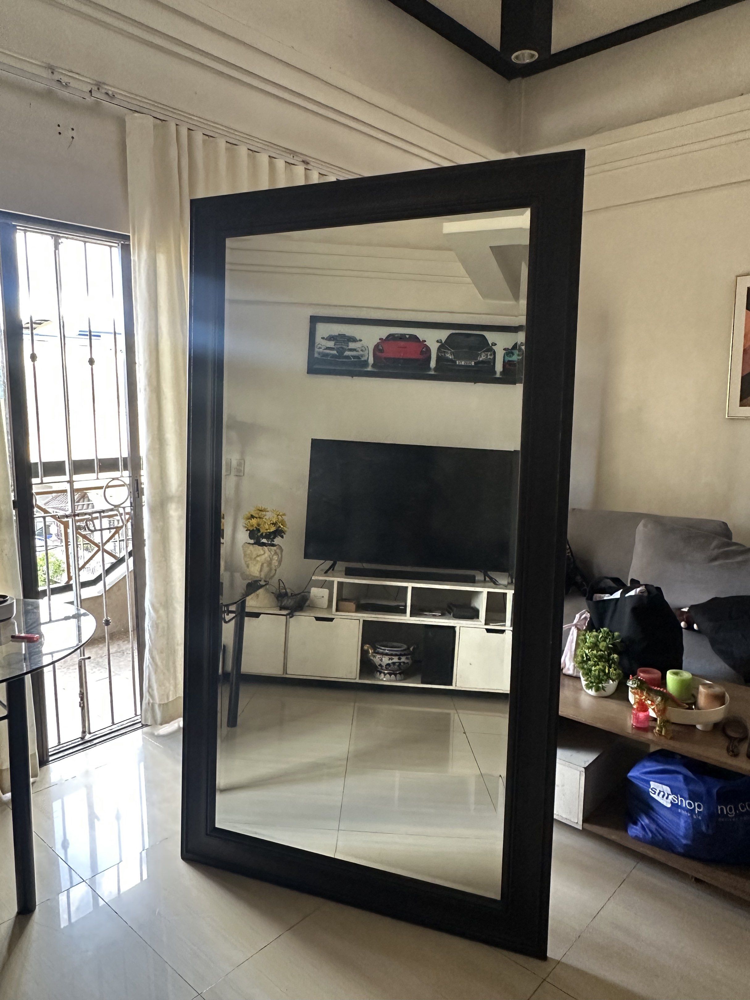 Large Black Framed Mirror (Category: Mirrors) located in Quezon City. Submitted by kimmana (Listing ID 1417604316, Image 1). Description: 80 x 44 1/2 inches - Full-length rectangular mirror - Black frame with decorative edge - Suitable for living room or bedroom.