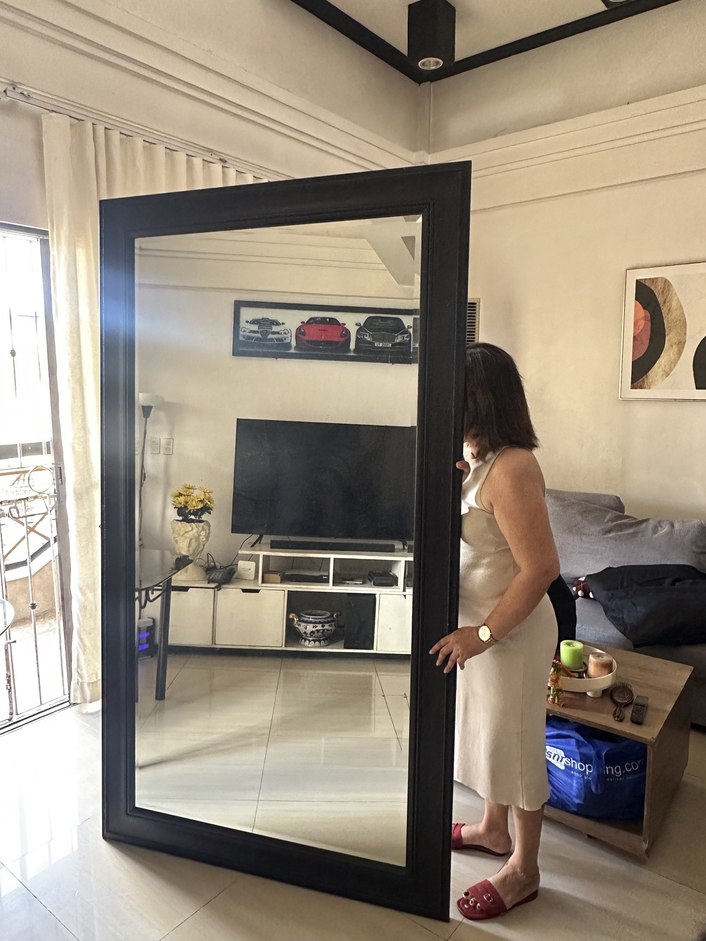 Large Black Framed Mirror (Category: Mirrors) located in Quezon City. Submitted by kimmana (Listing ID 1417604316, Image 2). Description: 80 x 44 1/2 inches - Full-length rectangular mirror - Black frame with decorative edge - Suitable for living room or bedroom.