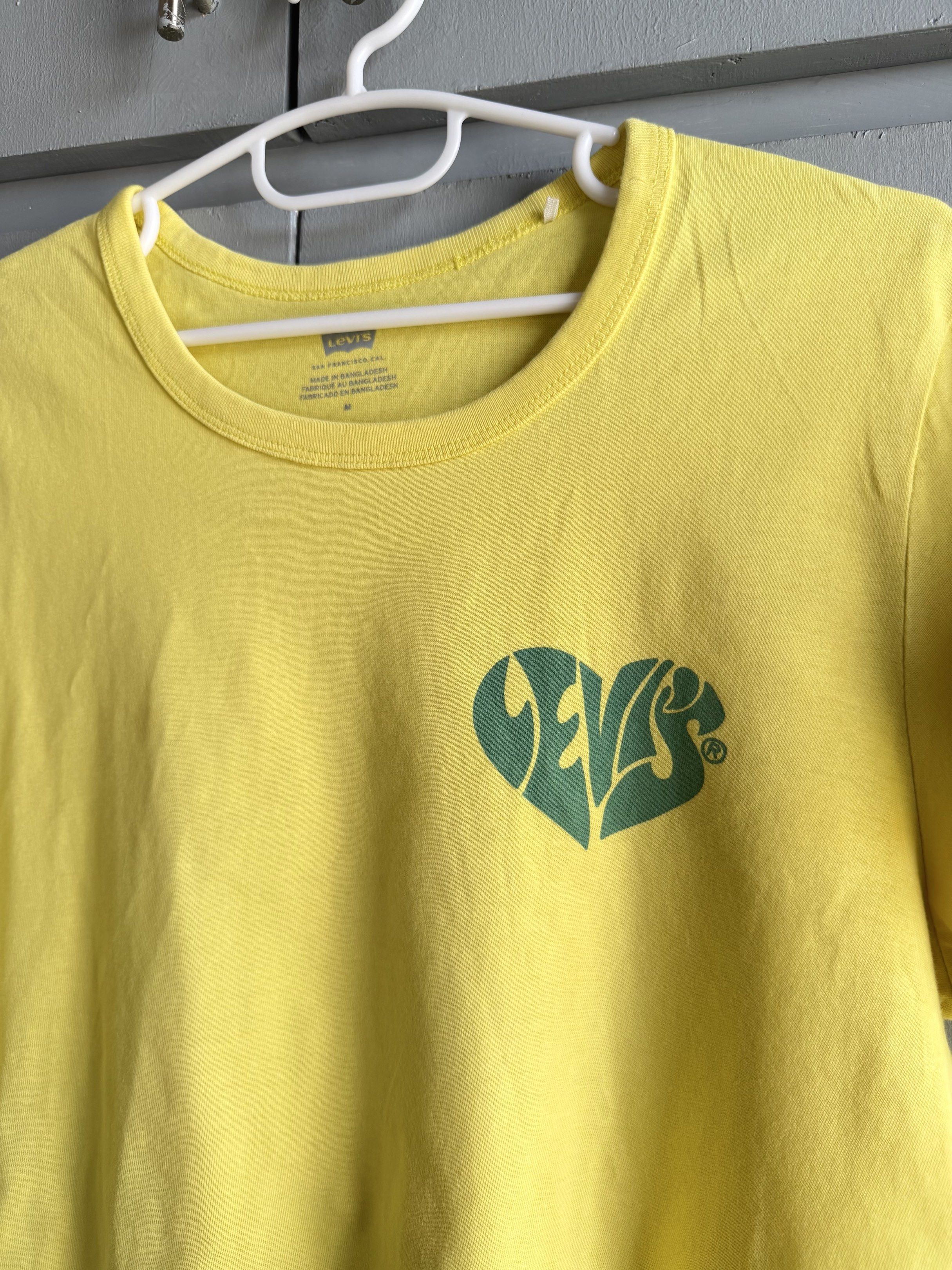 Levi's Yellow Hanging/ Cropped Top (Category: Shirts) located in San Juan City. Submitted by itemsfromkam (Listing ID 1417749811, Image 3). Description: • M on tag • v vibrant in person, slightly stretchable, nice backprint, hanging fit • also bought here for the same price but a bit loose on me.