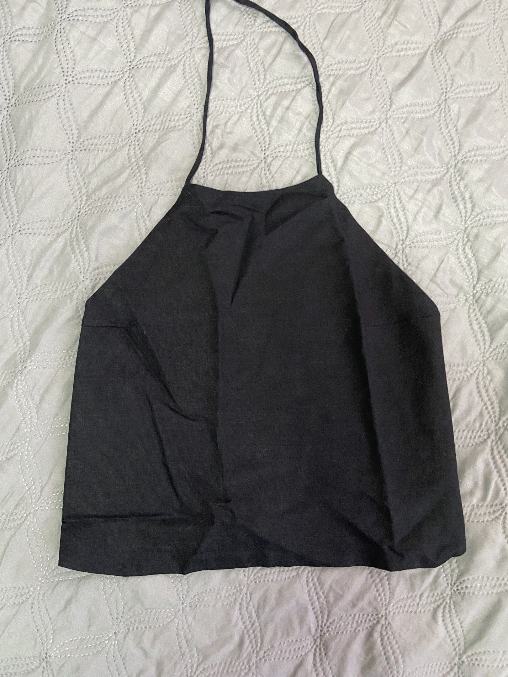 Linen Black Halter Top (Category: Sleeveless) located in Mandaluyong City. Submitted by decluttermyitems (Listing ID 1417604153, Image 1). Description: - Black halter top - Features a halter neck Linen fabric Backless Just needs ironing Ht: araw beas closet.