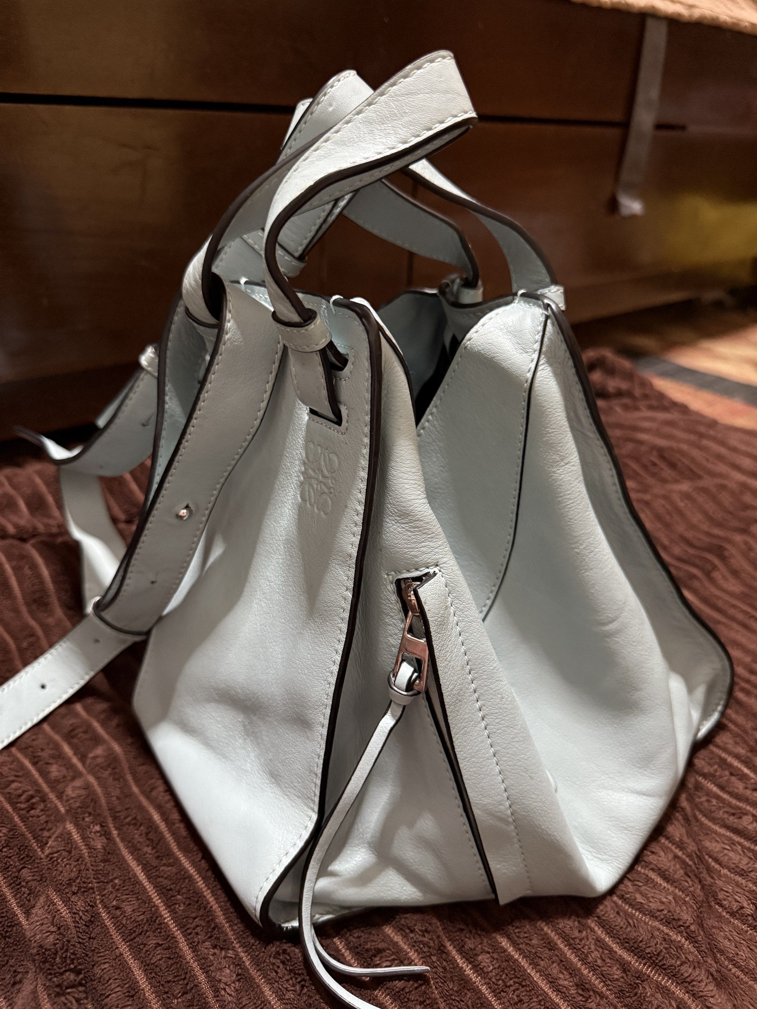 Loewe Hammock Bag - Light Blue (Category: Luxury Bags & Wallets) located in Tagbilaran City. Submitted by yvettecurso (Listing ID 1417663532, Image 3). Description: - Authenticity: Not guaranteed. No proof of purchase or authentication available. However, based on the quality, stitching, materials, and logo, the item appears authentic. Please manage expectations and feel free to have it authenticated. - Light Blue Color - Unique Geometric Design 