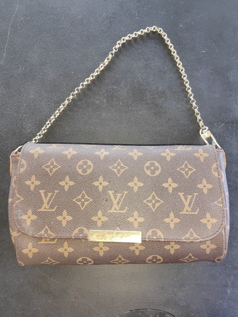 Louis Vuitton Monogram Clutch with Chain (Category: Luxury Bags & Wallets) located in Iloilo. Submitted by onyxpreloved.stuffs (Listing ID 1417614248, Image 1). Description: - Louis Vuitton Monogram clutch bag - Gold-tone chain strap - Flap closure with gold-tone metal bar - Purple interior lining - Includes serial number - Classic LV monogram pattern - Detachable strap strap 1900 each 2 for 3800 both coded..