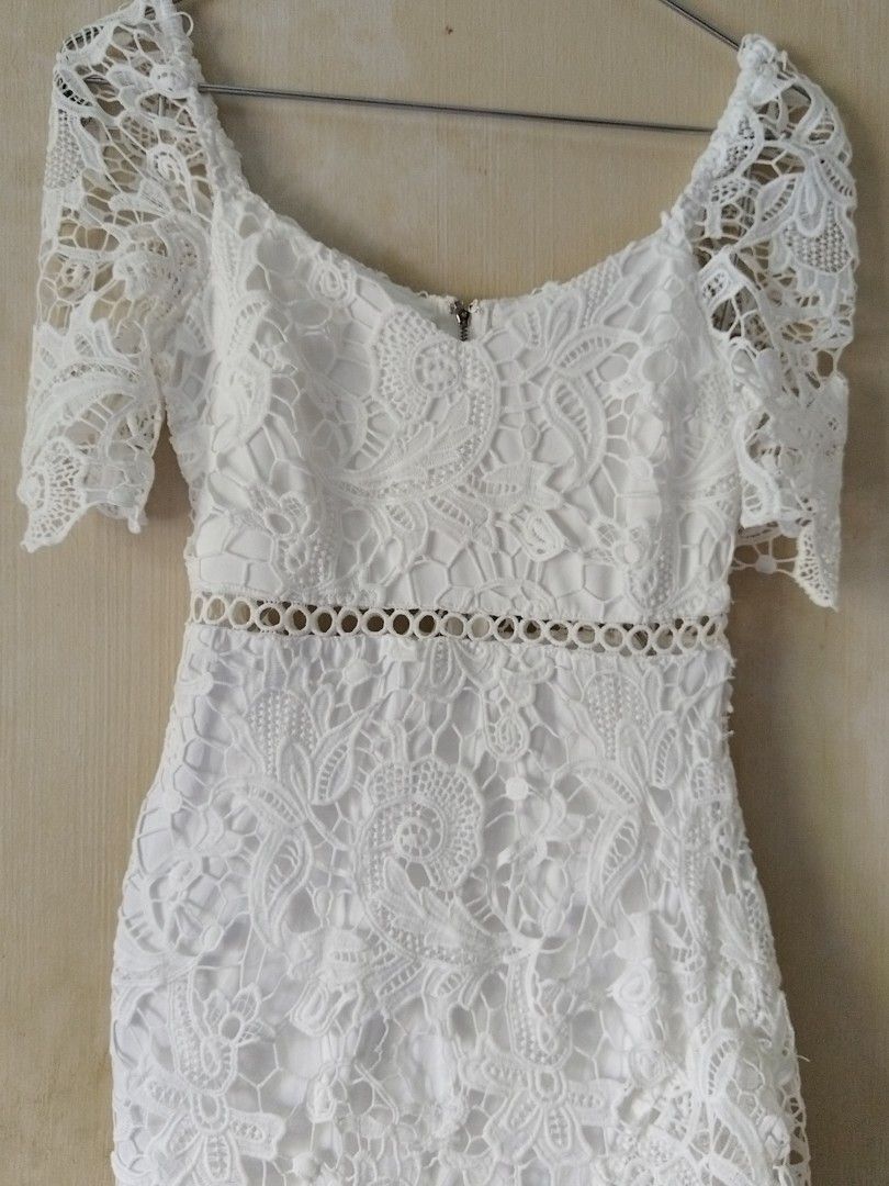 Lulus White Lace Dress - Size S (Category: Dresses) located in San Pablo. Submitted by ms.glen06 (Listing ID 1417654168, Image 2). Description: - Lulus white lace dress - Off-shoulder neckline - Fitted silhouette - Tiered skirt - Delicate lace overlay - Waist cutout detail - Has signs of usage - Size S - Ideal for special occasions.
