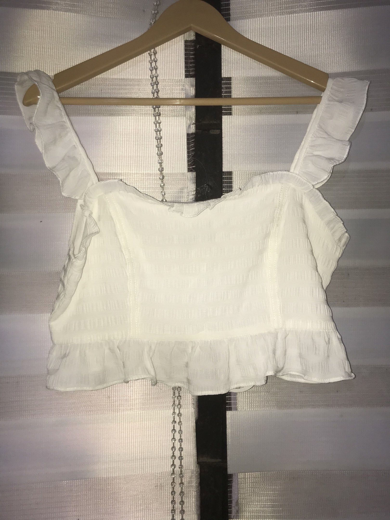 Luvalot White Ruffle Crop Top (Category: Others Tops) located in Makati City. Submitted by closet.declutterph (Listing ID 1417783254, Image 1). Description: - Luvalot white crop top - Ruffle details - Square neckline - Ruffle straps - Textured fabric - Size: UK 12, EUR 40, US 8 - New with tags.