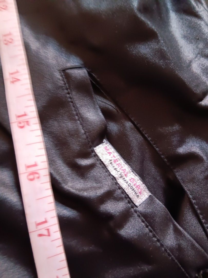 Material Girl Black Jacket (Category: Coats, Jackets and Outerwear) located in Manila. Submitted by declutteraf (Listing ID 1417649373, Image 3). Description: - Material Girl black jacket - Zipper closure - Ribbed collar and cuffs - Shiny material - Front pocket - Chest measurement: approximately 17 inches.