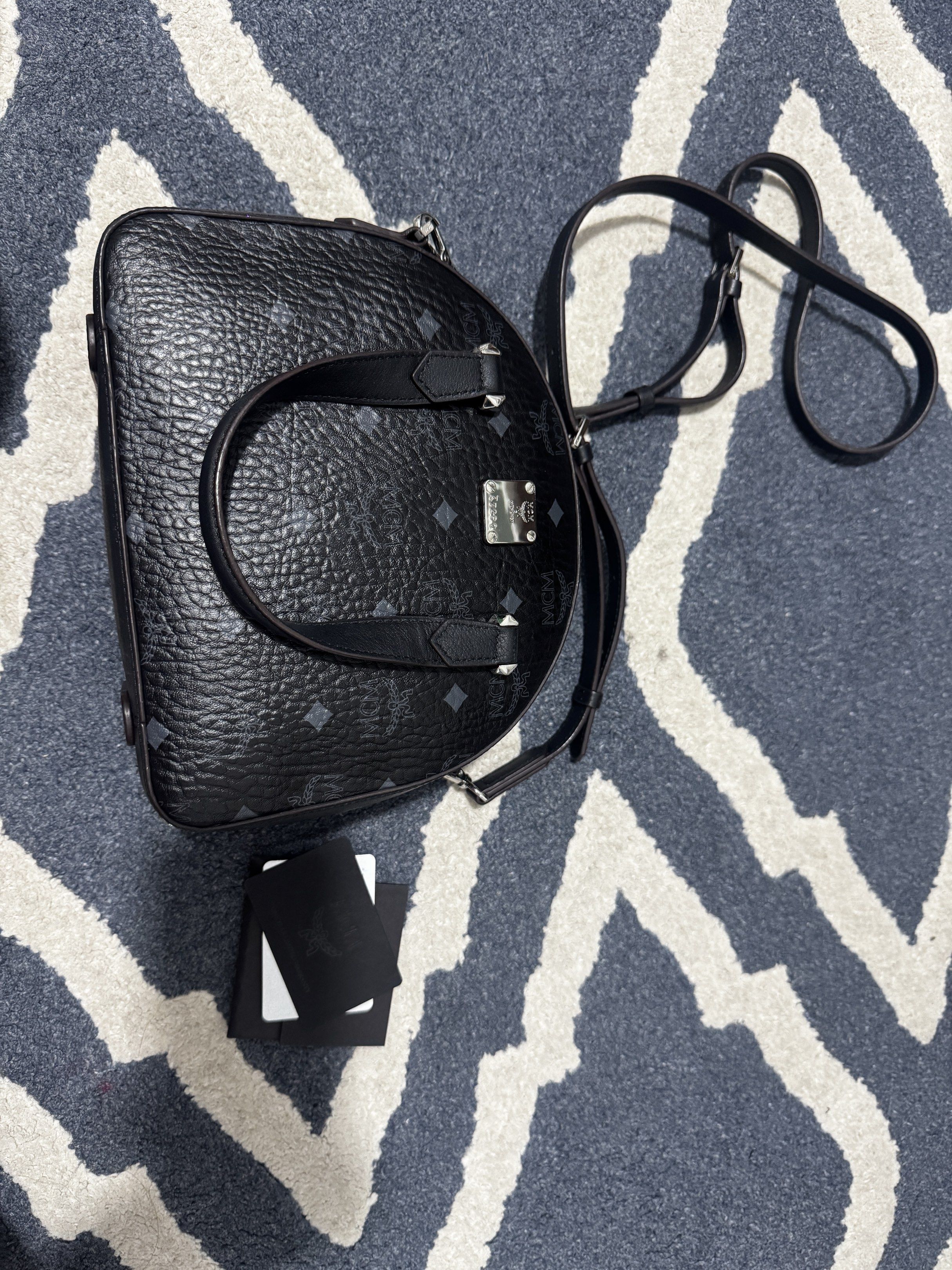 MCM Mini Boston Bag Black (Category: Luxury Bags & Wallets) located in Manila. Submitted by tin_preloved_028 (Listing ID 1417752762, Image 1). Description: - Authentic MCM mini Boston bag - Black color - Iconic MCM logo pattern - Top handle and Body Bag - Detachable shoulder strap - Includes original cards - Secure zip closure - Stylish and compact - with Dust Bag .