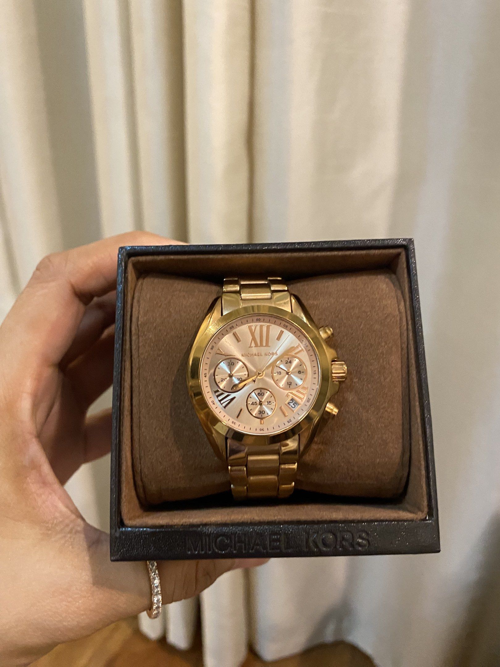 Michael Kors Gold Chronograph Watch (Category: Luxury Watches) located in Las Pinas. Submitted by mimachay (Listing ID 1417740482, Image 1). Description: - Michael Kors rose gold chronograph watch - rose Gold-tone stainless steel bracelet - Matching gold dial with sub-dials - Comes with original box - Includes extra links - Stylish and functional.