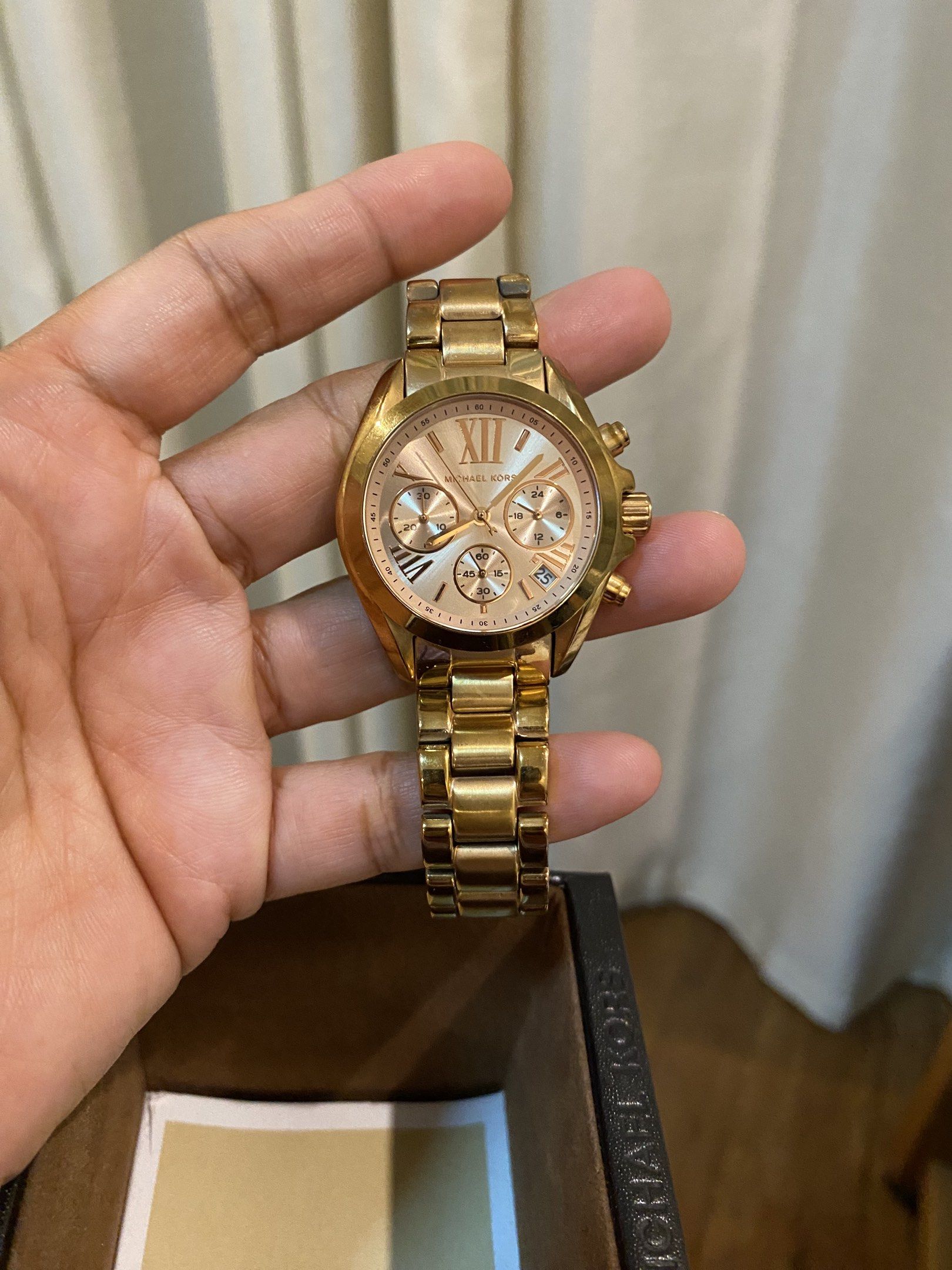 Michael Kors Gold Chronograph Watch (Category: Luxury Watches) located in Las Pinas. Submitted by mimachay (Listing ID 1417740482, Image 2). Description: - Michael Kors rose gold chronograph watch - rose Gold-tone stainless steel bracelet - Matching gold dial with sub-dials - Comes with original box - Includes extra links - Stylish and functional.