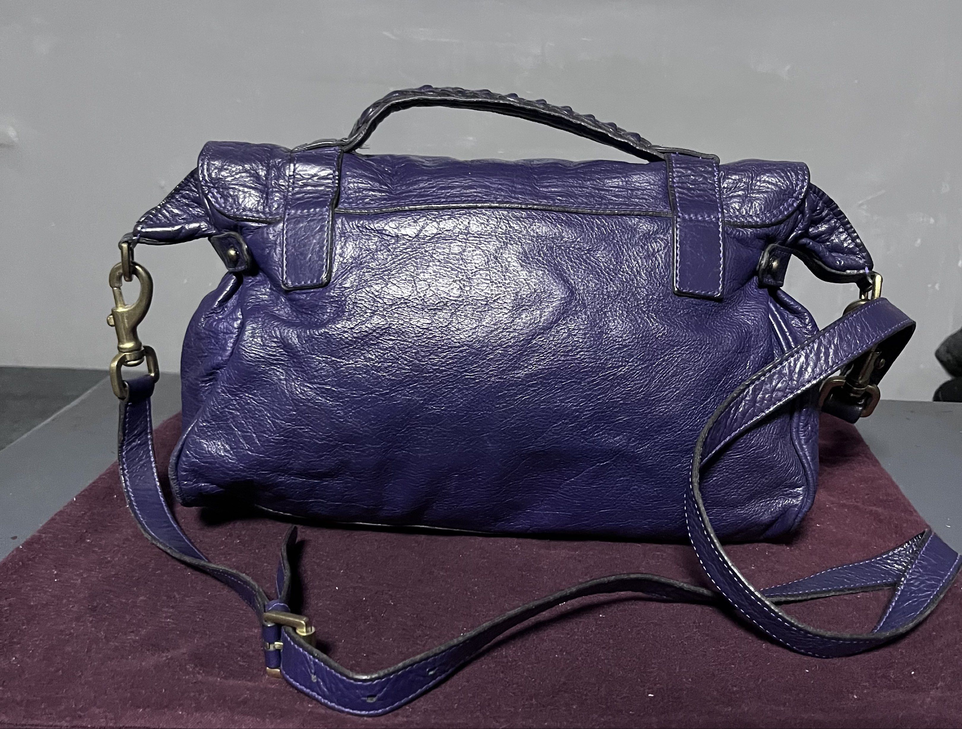 Mulberry Alexa Satchel Bag - Violet (Category: Luxury Bags & Wallets) located in Quezon City. Submitted by raycruz55 (Listing ID 1417709099, Image 3). Description: - AUTHENTIC Mulberry Alexa Satchel Bag - Color: Violet - Complete with DUST BAG & PAPERS - Condition: Lightly Used; no major flaws, the leather just needs a bit of cleaning (see last picture).