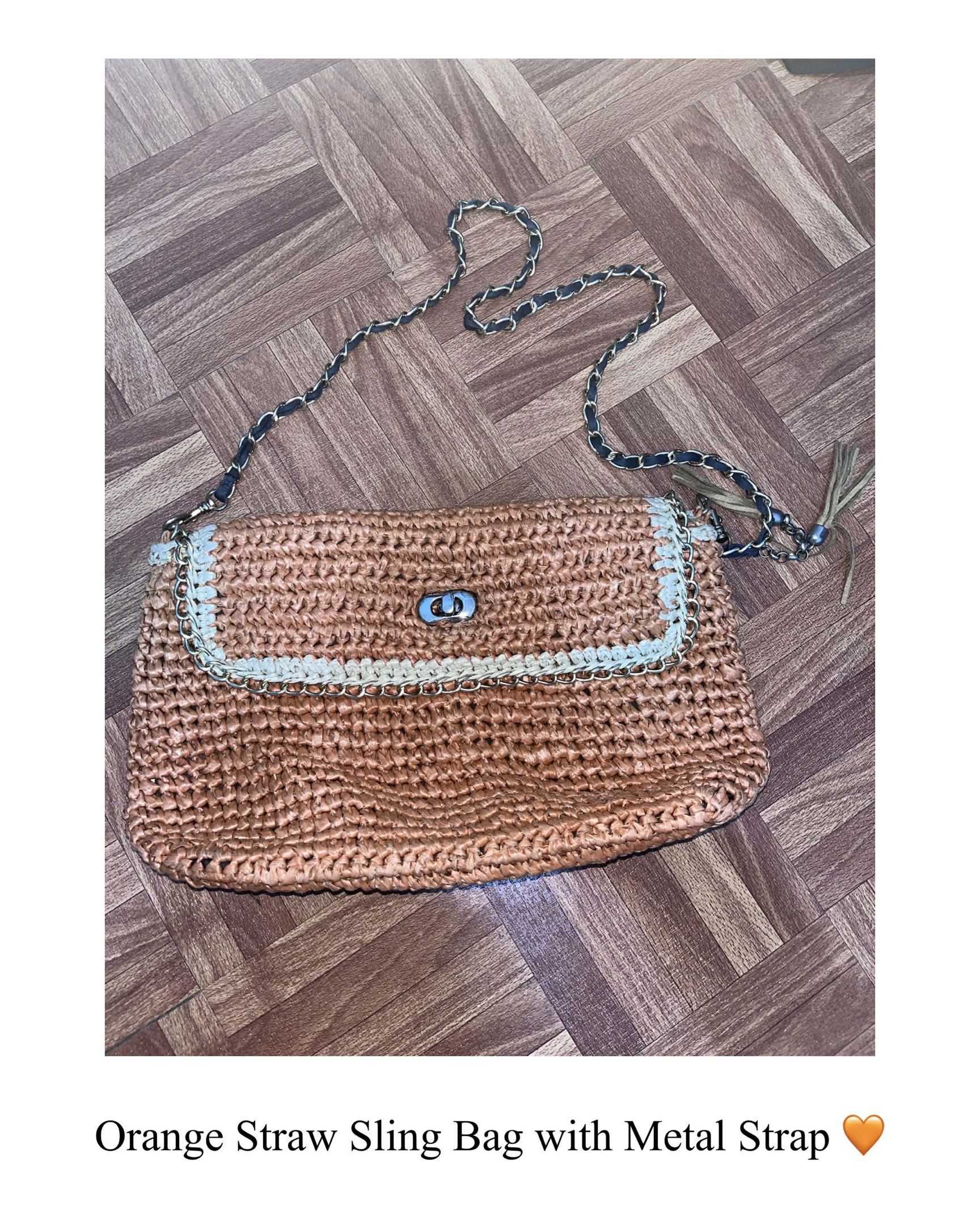 Orange Straw Sling Bag with Metal Strap (Category: Cross-body Bags) located in Quezon City. Submitted by mikkoimon (Listing ID 1417760676, Image 1). Description: - Orange straw sling bag - Metal chain strap - Flap closure with silver-tone clasp - Decorative tassel - Great size for essentials - Stylish for casual outings.