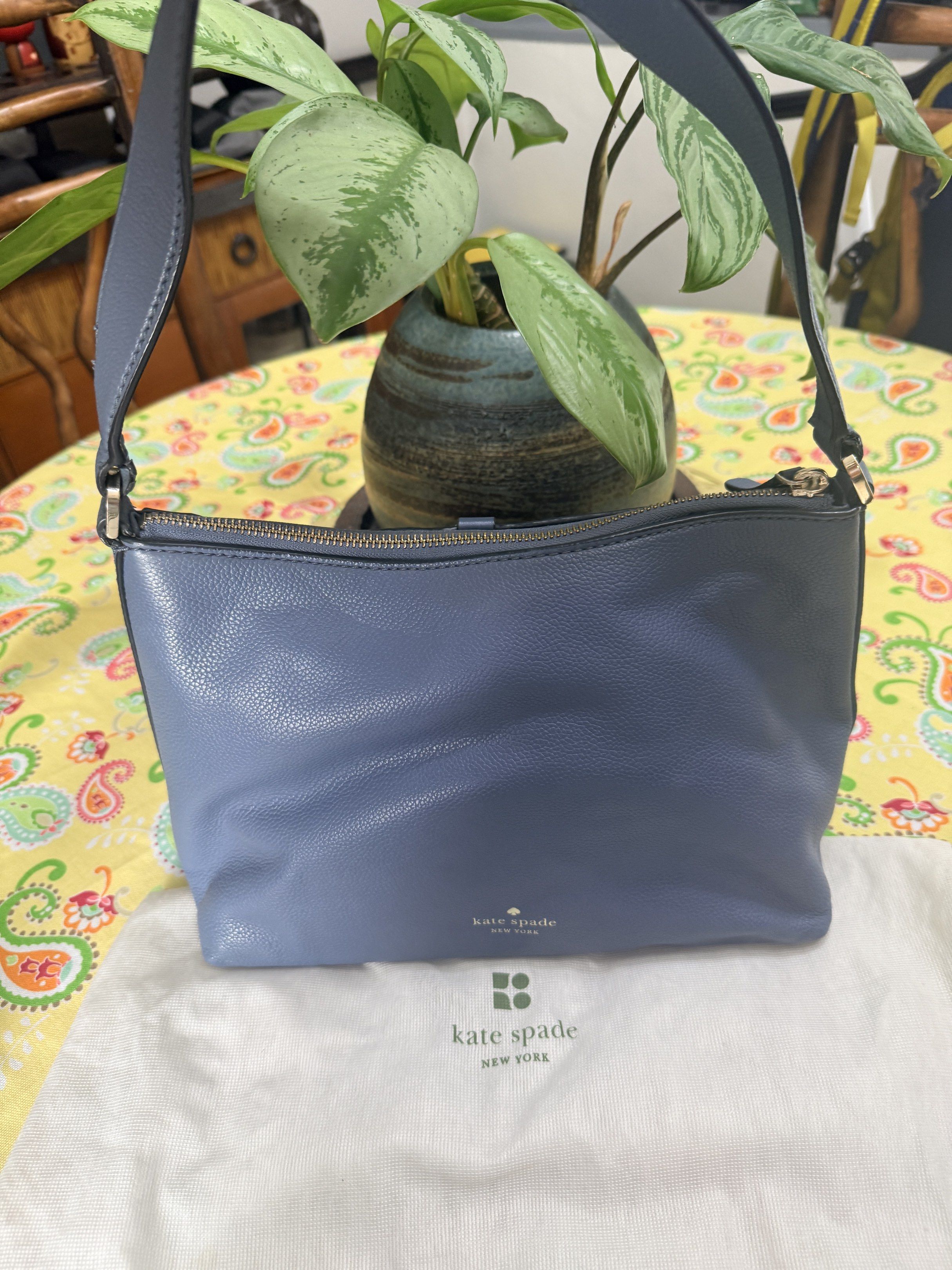Original Kate Spade Blue Shoulder Bag (Category: Luxury Bags & Wallets) located in Quezon City. Submitted by coco88. (Listing ID 1417665890, Image 1). Description: - Kate Spade shoulder bag - Beautiful blue color - Top zipper closure - Adjustable strap included - Comes with a dust bag - Interior has a small pocket - Stylish flap with tassel detail.