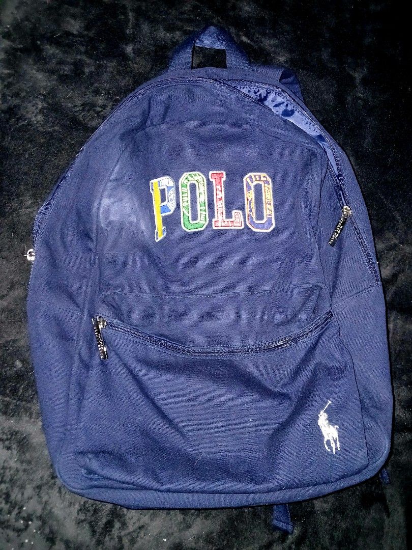 Polo Ralph Lauren Backpack (Category: Backpacks) located in Manila. Submitted by gabbb.dgzmn035 (Listing ID 1417628346, Image 1). Description: RALPH LAUREN POLO BACKPACK 💰 PHP 690 (NEGOTIABLE) • Authentic Ralph Lauren (POLO) • Navy Blue color • Multicolor embroidered “POLO” logo • White Polo pony logo • Spacious main compartment • Front zippered pocket • Smooth, working zippers • Durable fabric material • Made in China exclusively for Ralph Laur