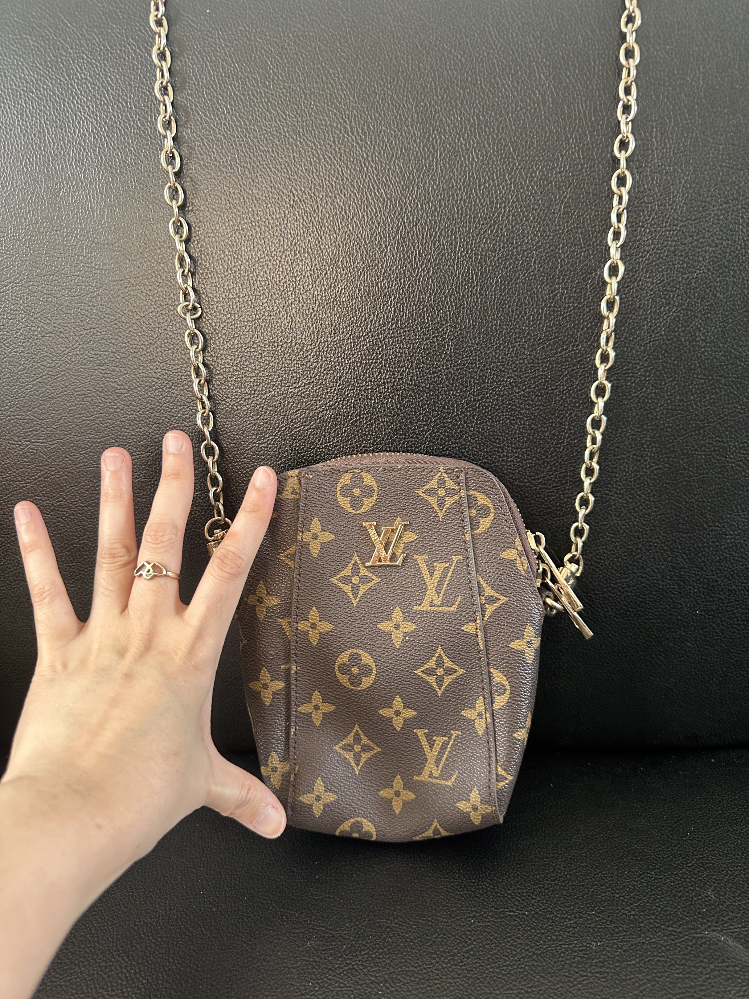 Louis Vuitton Leather Chain Phone bag (Category: Cross-body Bags) located in Mandaue City. Submitted by maeveywavy (Listing ID 1417662257, Image 2). Description: Preloved. Signs of wear. This was given to me so authenticity is not guaranteed. Good quality leather Chains straps faded but not noticeable. Very classy. .