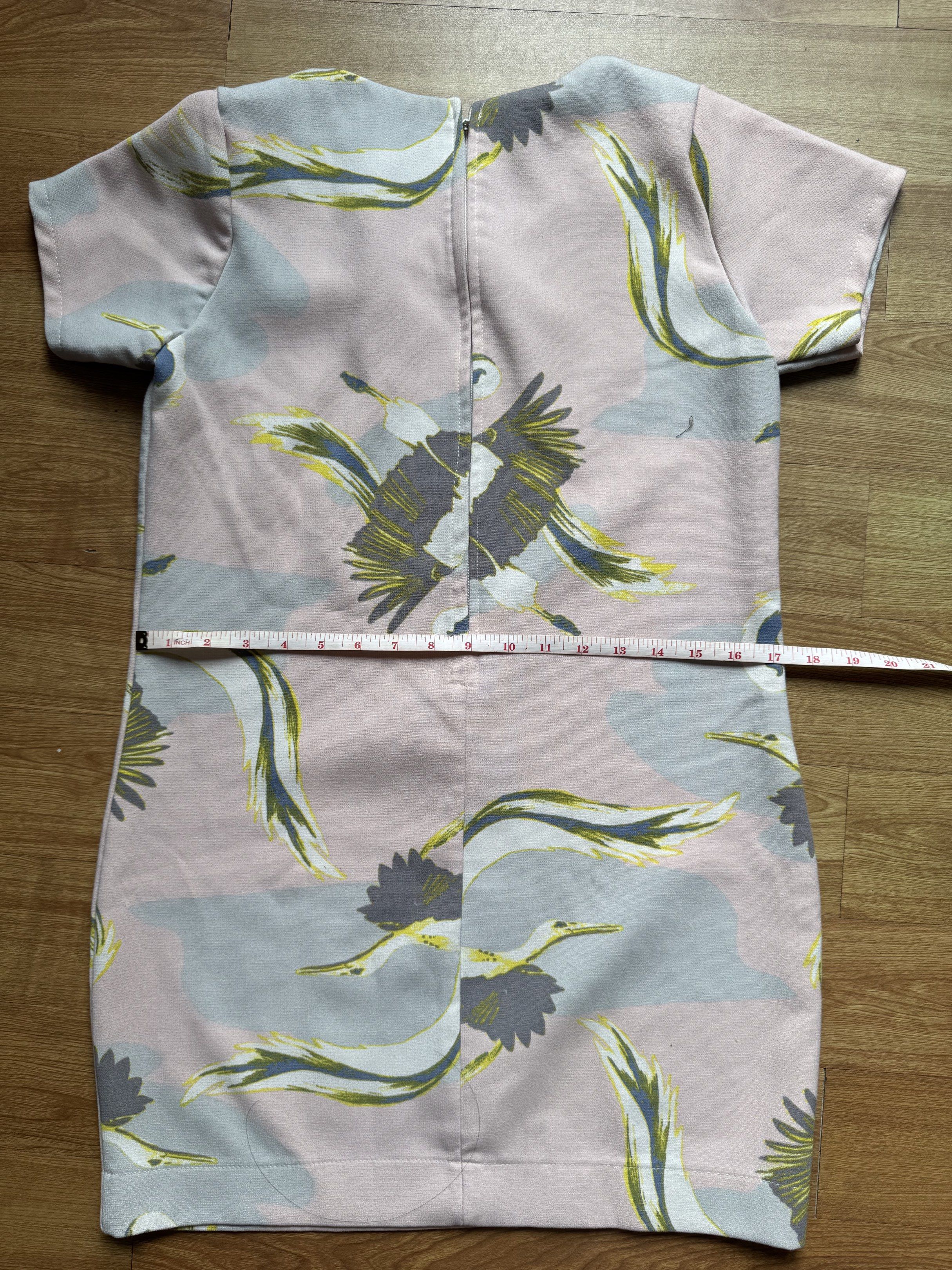 Printed Dress (Category: Dresses) located in Manila. Submitted by obach (Listing ID 1417735962, Image 3). Description: - Unique print with birds and abstract shapes - Colors: Pink, grey, and yellow - Short sleeves - Straight cut - Back zipper closure - Length: Approximately 32 inches - Bust: Approximately 18 inches across.