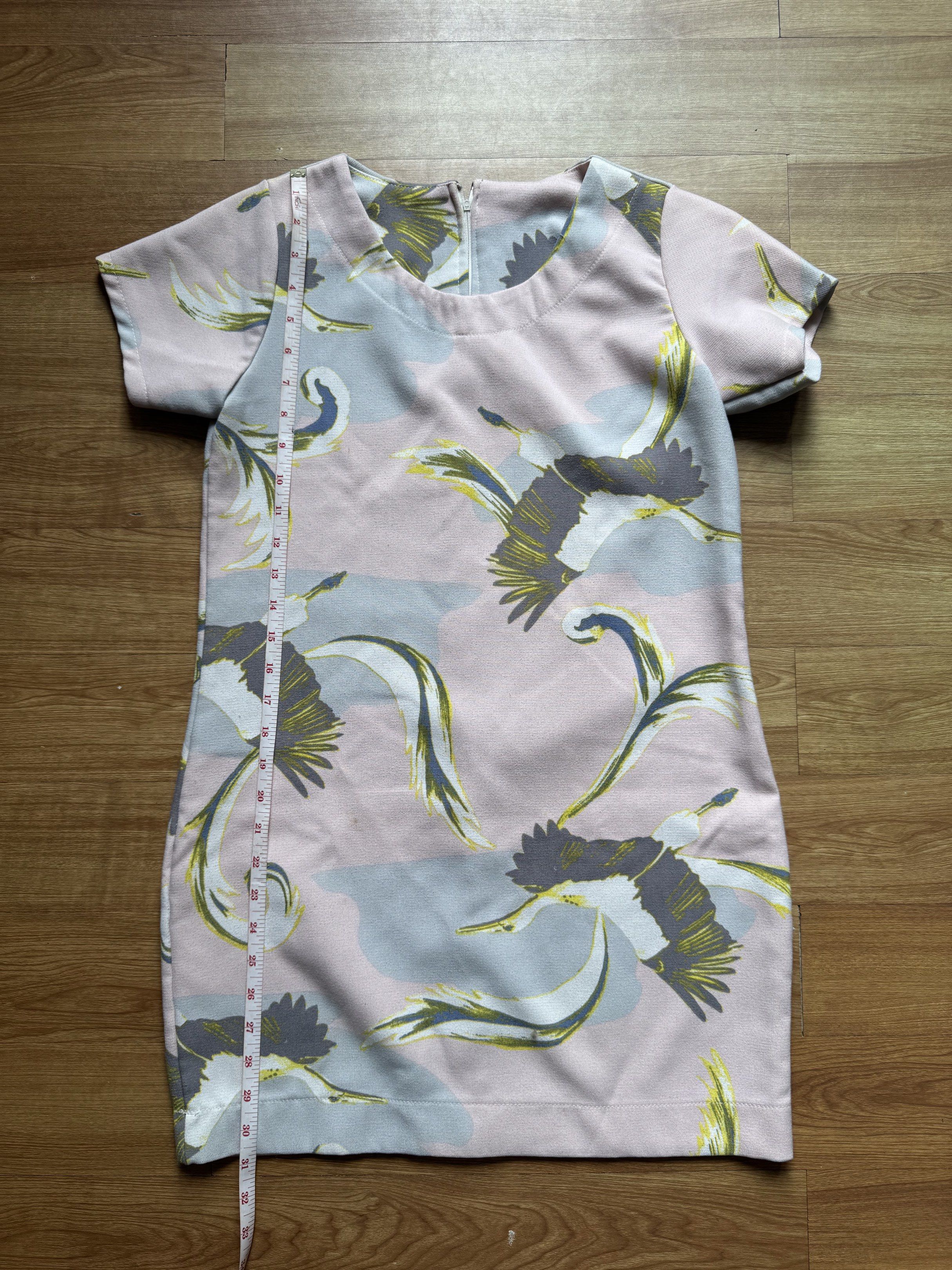 Printed Dress (Category: Dresses) located in Manila. Submitted by obach (Listing ID 1417735962, Image 1). Description: - Unique print with birds and abstract shapes - Colors: Pink, grey, and yellow - Short sleeves - Straight cut - Back zipper closure - Length: Approximately 32 inches - Bust: Approximately 18 inches across.