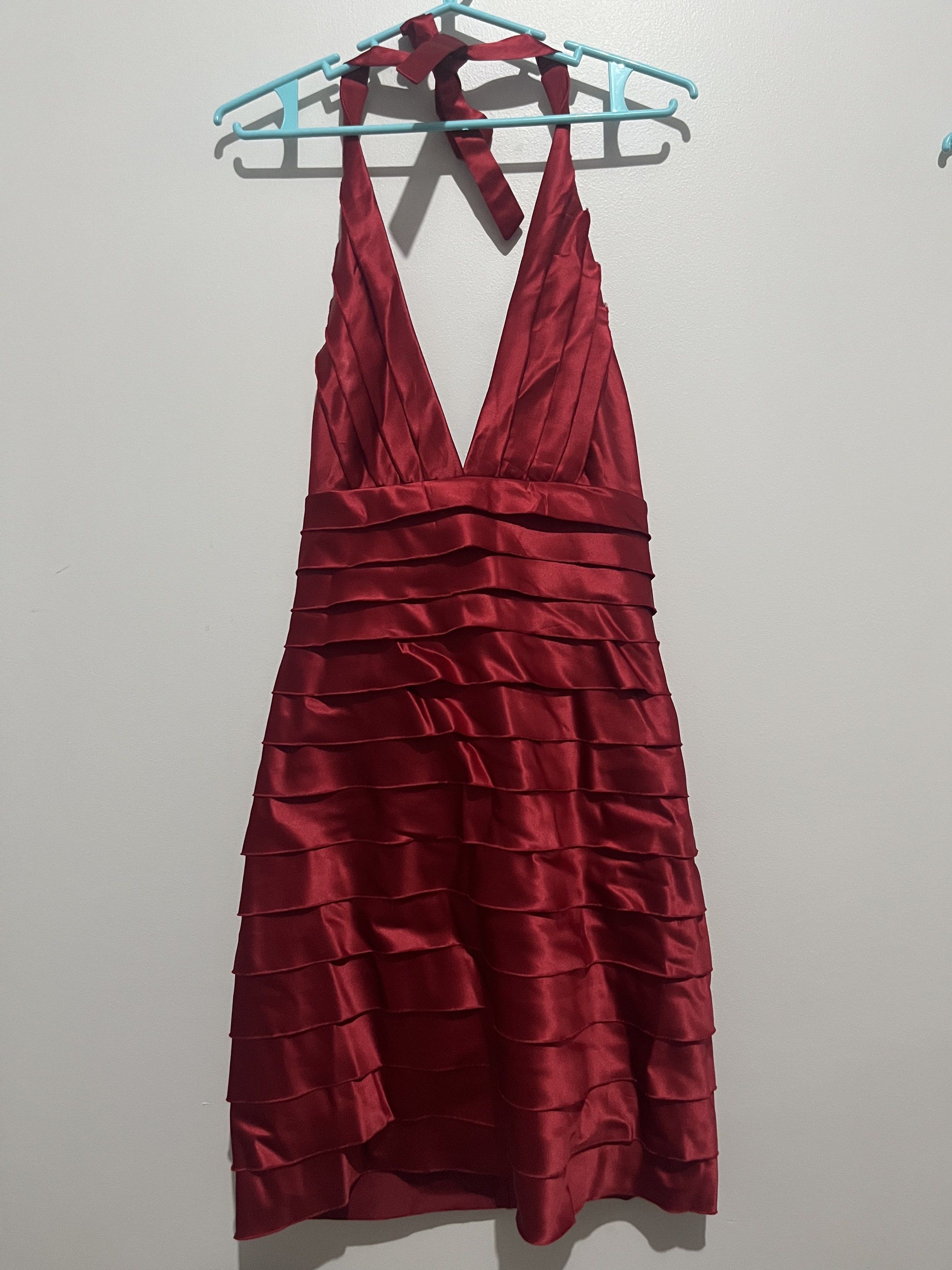 Red Halter Formal Cocktail Dress (Category: Dresses) located in Manila. Submitted by koi2koi (Listing ID 1417715836, Image 1). Description: - Elegant red halter neck dress - Deep V-neckline - Tiered ruffle design - Satin-like texture - Knee length - Halter straps tie at the back - Ideal for special occasions Fits S-M (Size 4 on tag).