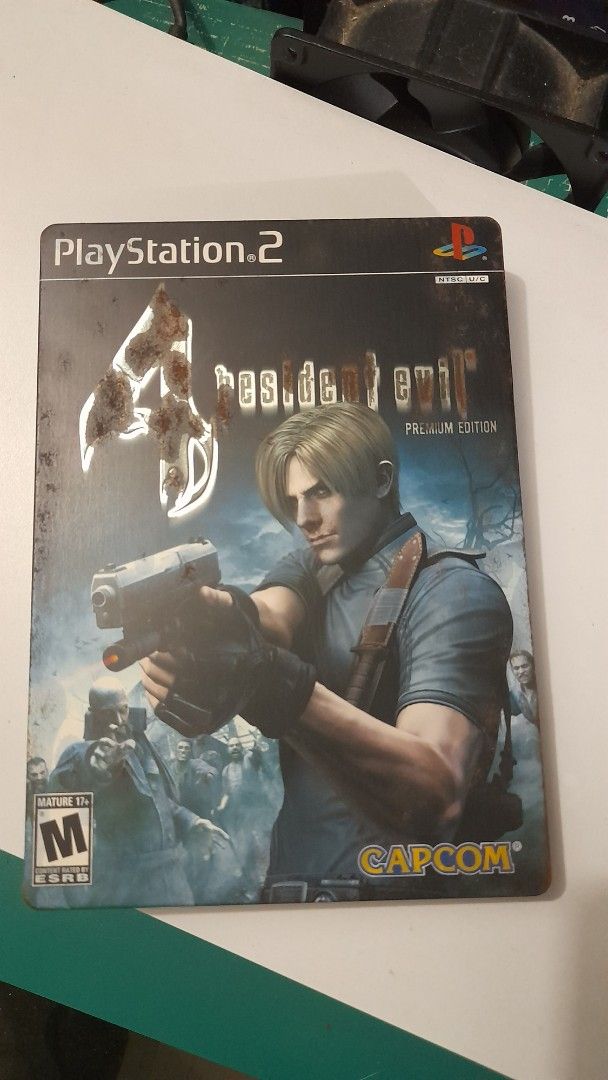 Resident Evil 4 Premium Edition - PS2 (Category: PlayStation) located in Caloocan City. Submitted by marvinchan139 (Listing ID 1417723017, Image 1). Description: - Resident Evil 4 Premium Edition for PlayStation 2 - Includes game disc, case, and manual - Features Leon Kennedy - Rated M for Mature - Includes DVD - missing ada Wong picture - with some rust on the steelbook case so manage your expectations. - Manufactured by Capcom.