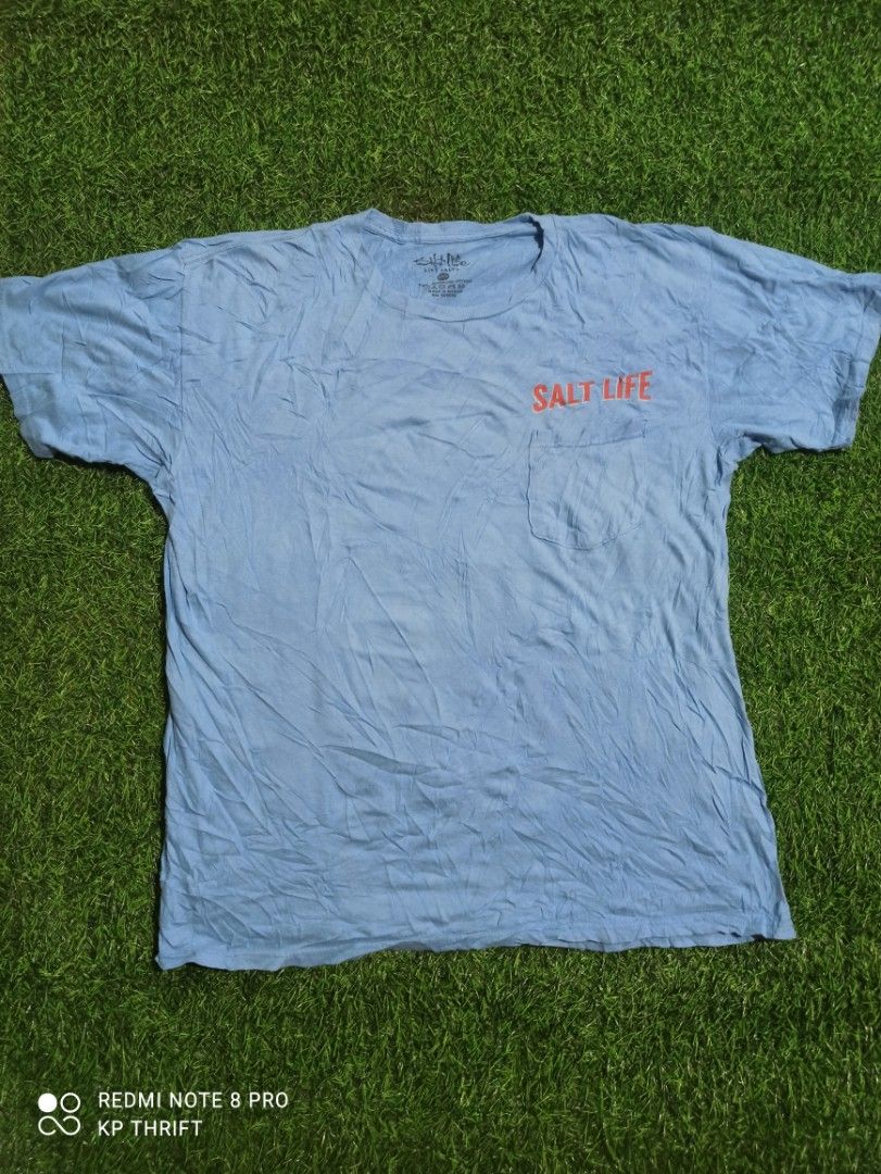 Salt Life Blue T-Shirt (Category: Tshirts & Polo Shirts ) located in Pasig City. Submitted by goofyflip (Listing ID 1417776340, Image 1). Description: Blue Salt Life t-shirt with a pocket on the front. Features a crab graphic on the back with the words "Salt Life" and "Red, White & Blue Crab". Made of 100% preshrunk cotton. Size is Large. Made in Mexico..