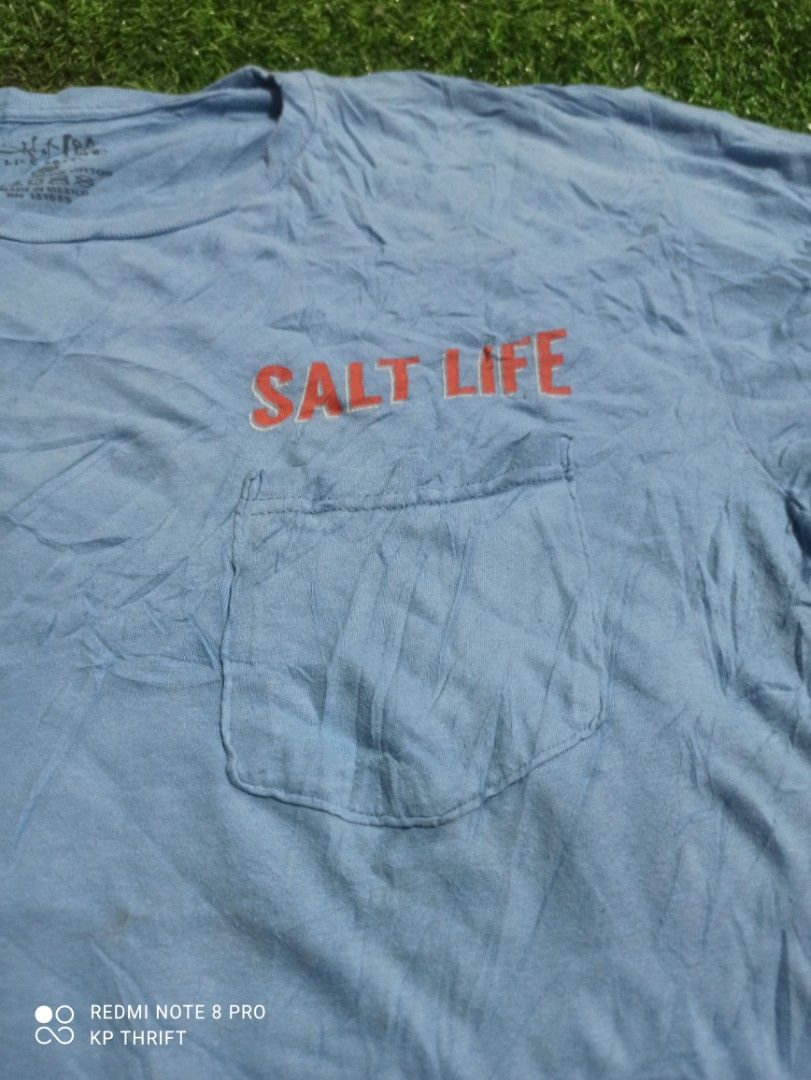 Salt Life Blue T-Shirt (Category: Tshirts & Polo Shirts ) located in Pasig City. Submitted by goofyflip (Listing ID 1417776340, Image 3). Description: Blue Salt Life t-shirt with a pocket on the front. Features a crab graphic on the back with the words "Salt Life" and "Red, White & Blue Crab". Made of 100% preshrunk cotton. Size is Large. Made in Mexico..