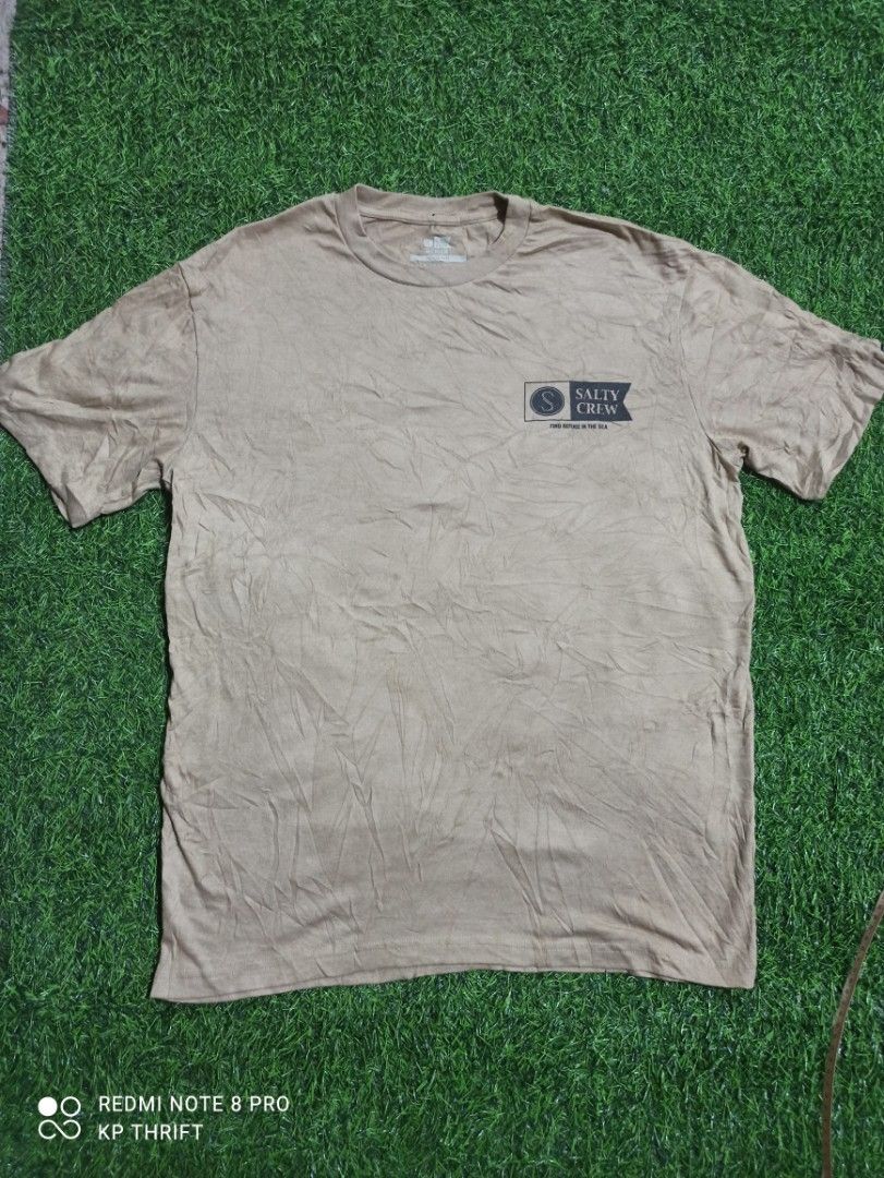 Salty Crew Medium Standard T-Shirt (Category: Tshirts & Polo Shirts ) located in Pasig City. Submitted by goofyflip (Listing ID 1417776111, Image 2). Description: - Salty Crew t-shirt - Size: Medium - Color: Neutral - Features Salty Crew logos (front and back) - Crew neck design - Comfortable material - Ideal for casual wear.