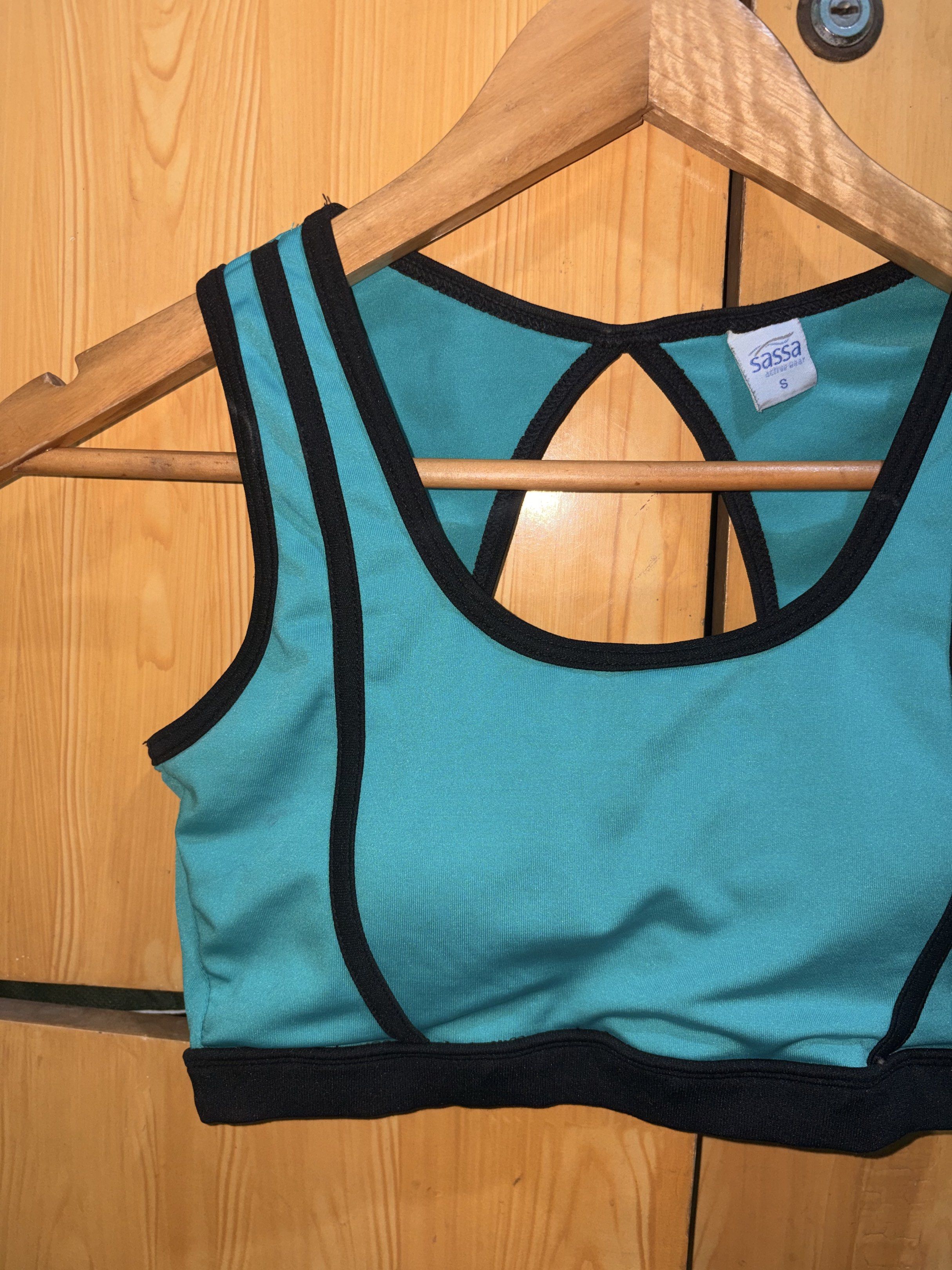 Sassa Sports Bra - Size S (Category: Activewear) located in Manila. Submitted by ciiii1 (Listing ID 1417734470, Image 1). Description: - Sassa sports bra - Teal color with black trim - Racerback design - Keyhole detail - Built-in padding - Size: S fits S-M - Perfect for workouts and everyday wear.